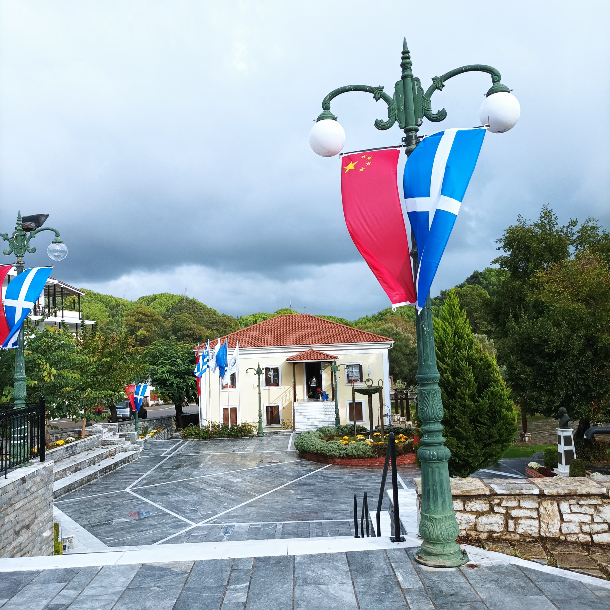 The Chinese and Greek flags pictured outside the Town Hall in Ancient Olympia ©ITG 