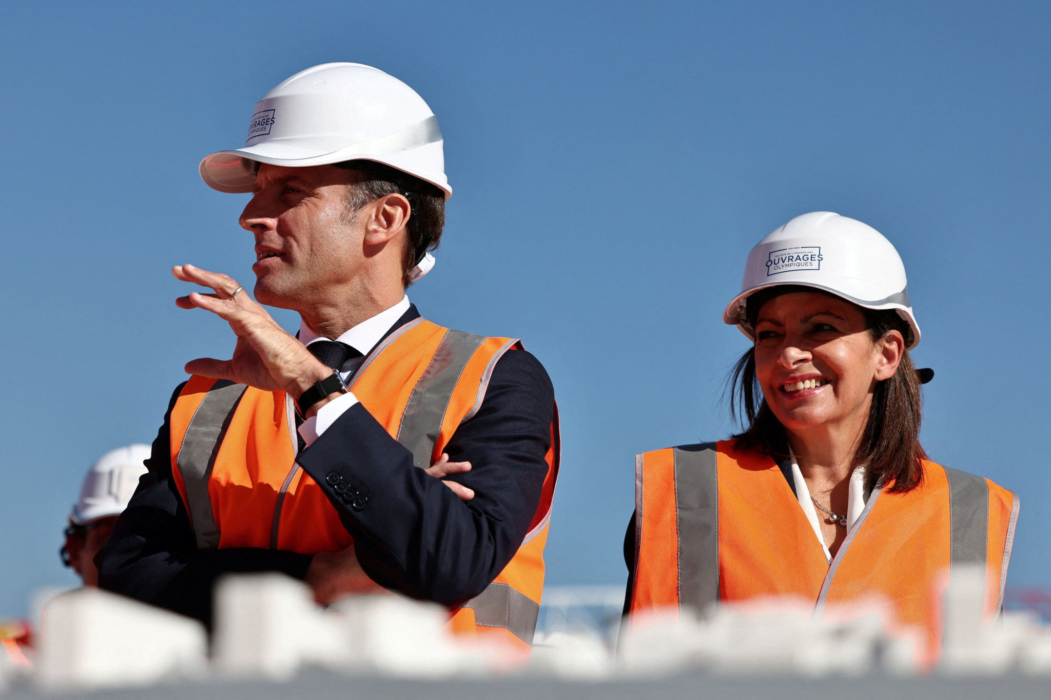 Paris 2024 President Tony Estanguet, left, and Hidalgo visited the construction site for the Olympic Village in Saint-Ouen amid criticisms regarding investment in the legacy of the Games ©Getty Images