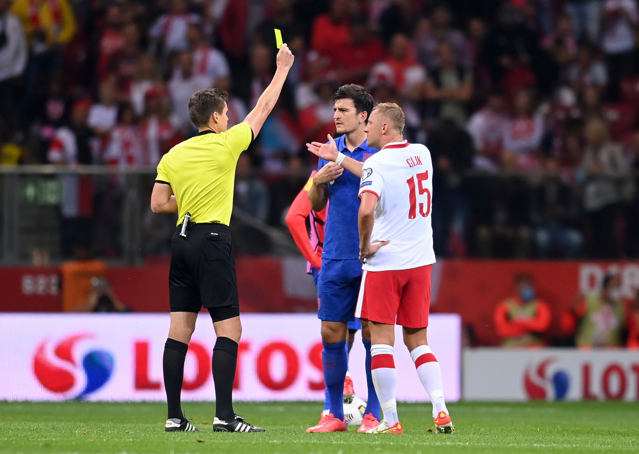 Kamil Glik, white, and Harry Maguire, blue, were both bookde after the incident at half-time, but FIFA took no further action ©Getty Images