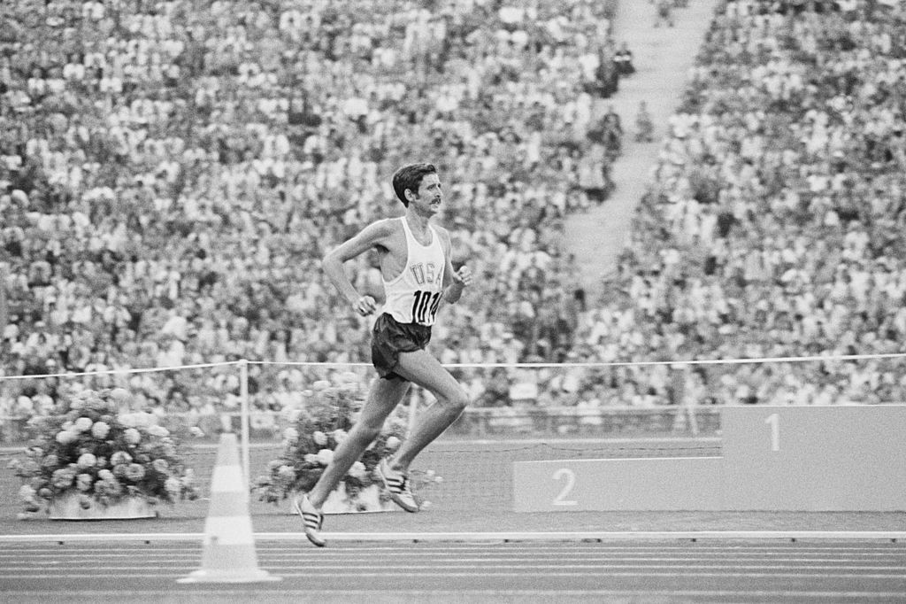 Frank Shorter of the United States completing a lap of the stadium at the 1972 Munich Olympics en route to the marathon title after his thunder had been stolen by a home hoaxer who had entered the arena shortly beforehand ©Getty Images