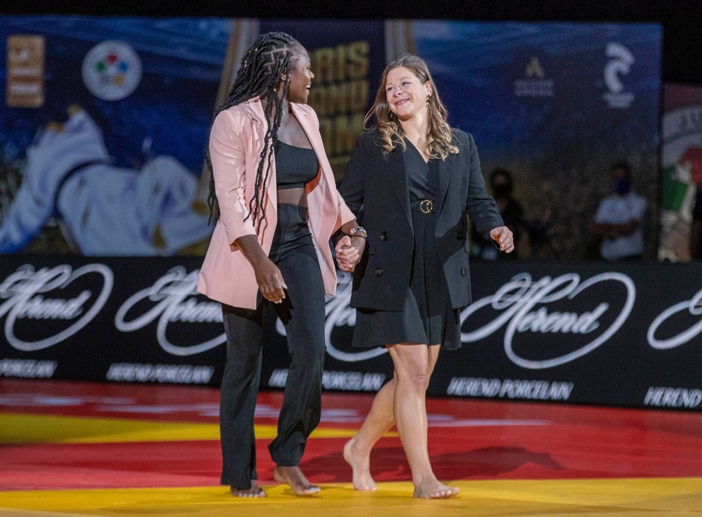 Women's under-63kg gold medallists at the last two Olympics, Clarisse Agbegnenou of France, left, and Tina Trstenjak of Slovenia, were among the judoka to address the Paris crowd on the tatami before the finals ©IJF
