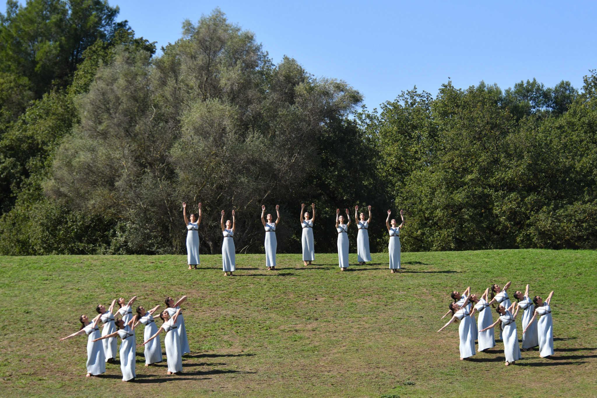 Actresses playing the role of Priestesses dance during the Flame Lighting Ceremony in Ancient Olympia ©Getty Images 