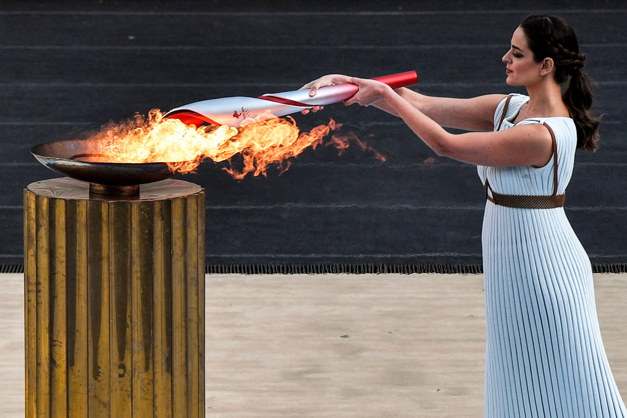 Actress Xanthi Georgiou, in the role of High Priestess, lights the Olympic Torch ©Getty Images 