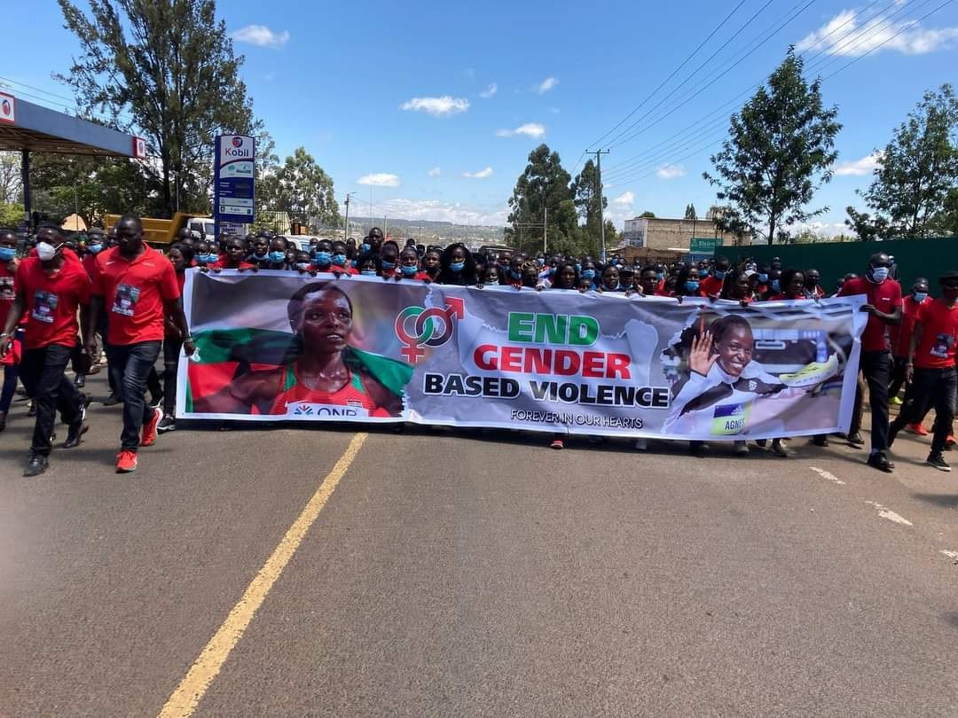 Mourners carried a large banner with the phrase "End Gender-Based Violence" through the streets of Eldoret ©Athletics Kenya