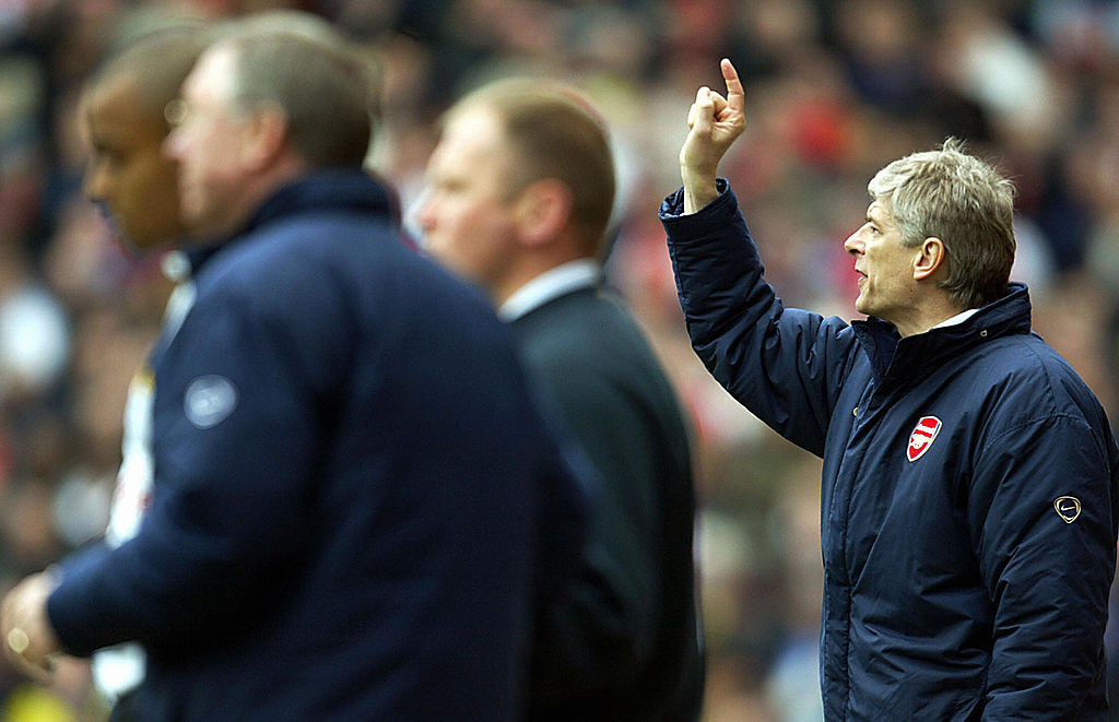 Arsene Wenger shouts instructions to his Arsenal team in 2004, the year in which they fell one short of a 50-game unbeaten run in the Premier League when beaten 2-0 by Manchester United ©Getty Images 