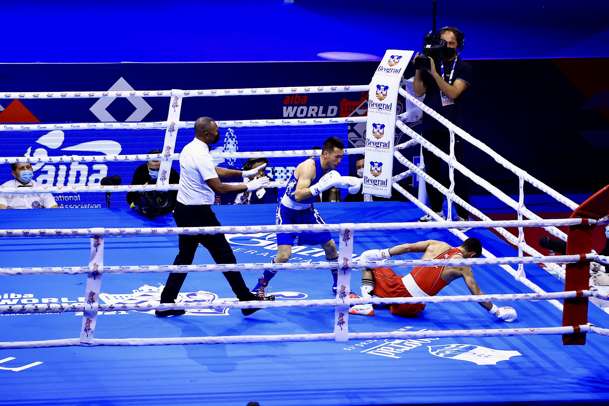 Mongolia's Enkh-Amar Kharkuu knocks down Kazakhstan's Serik Temirzhanov, but the Asian champion went on to lose the bout ©AIBA