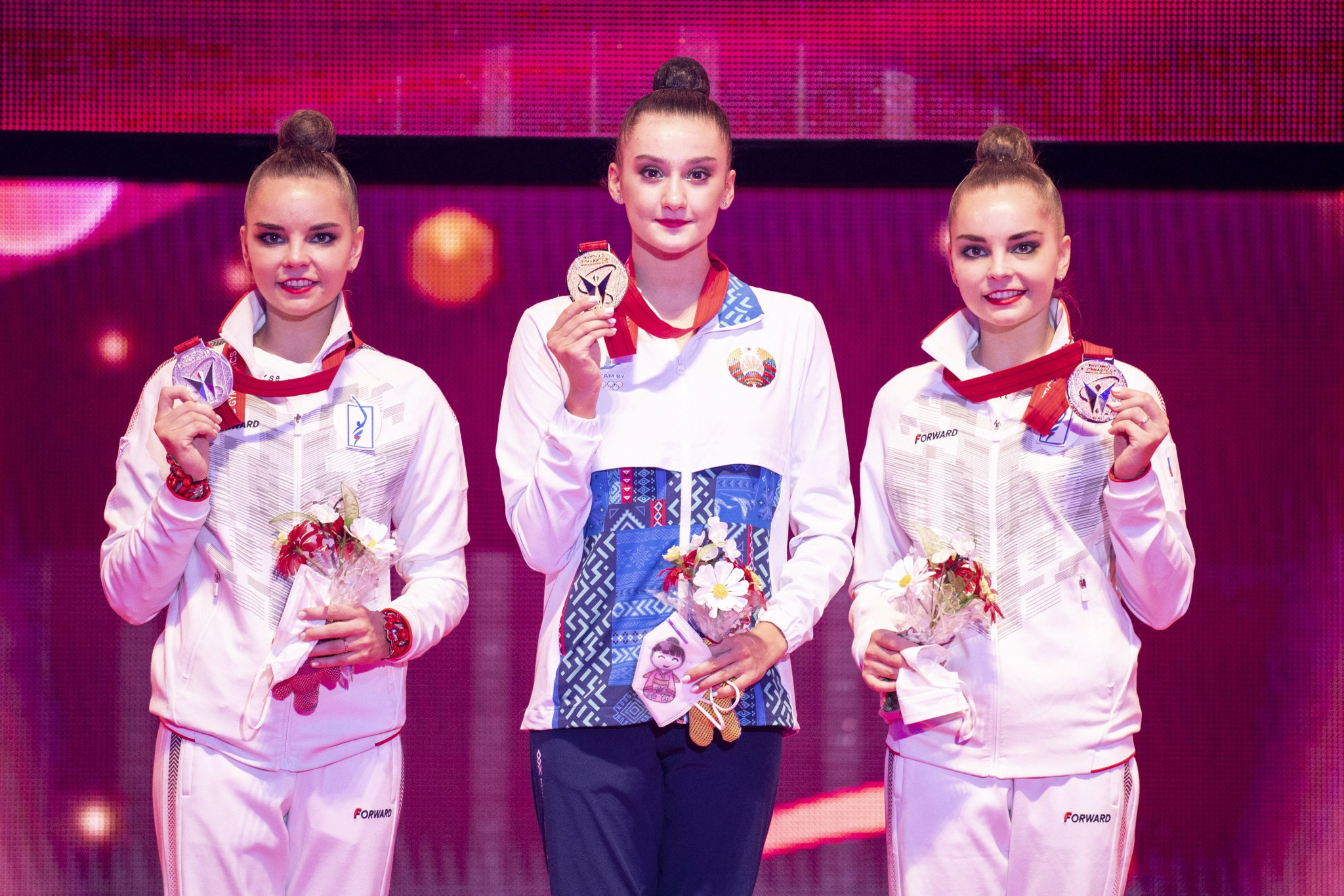 Alina Harnasko, middle, won gold in the individual ribbon to prevent another one-two finish for the Averina twins ©Getty Images