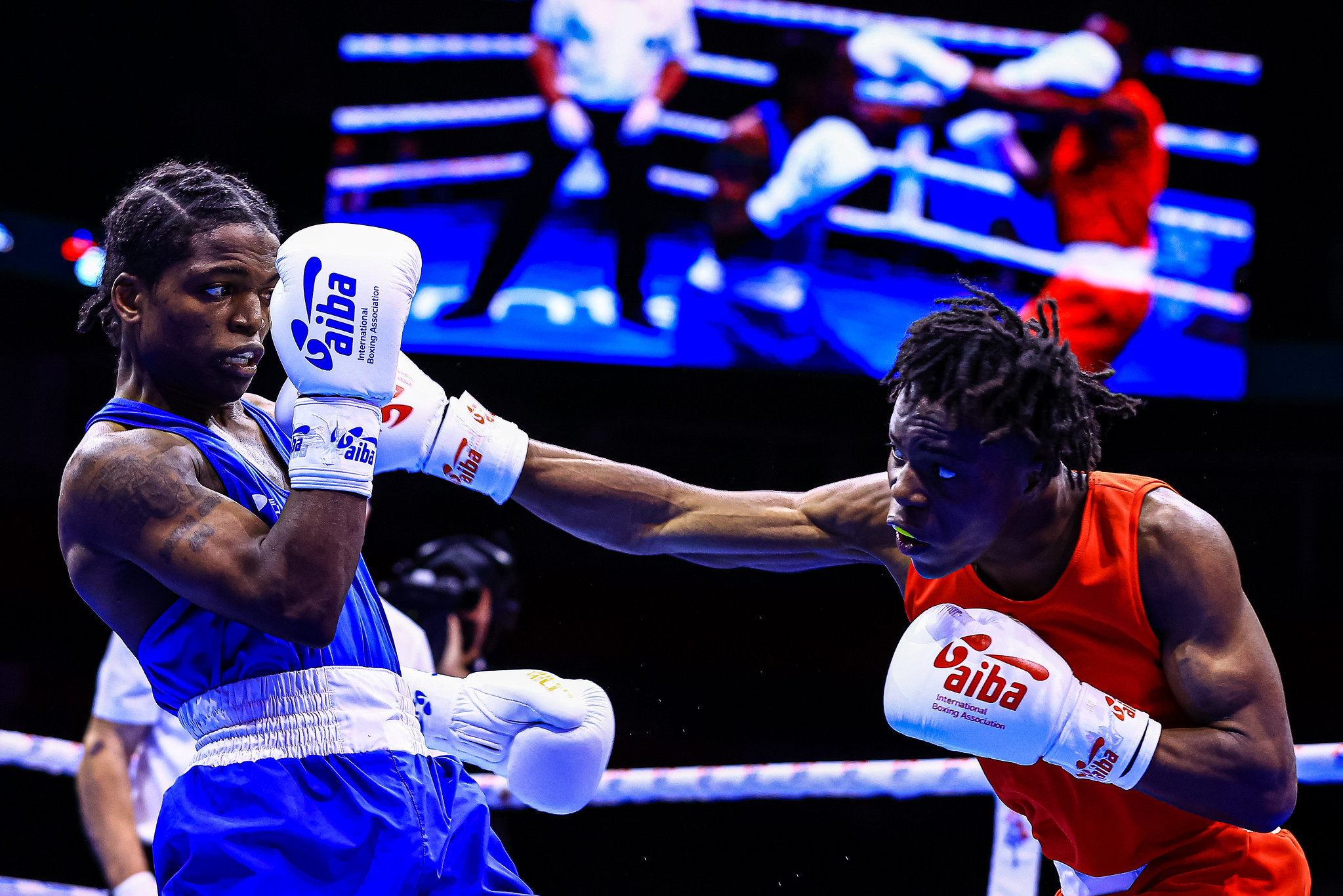 Fair Chance Team's Abdule-Fawaz Aborode, red, defeated Anthony Joseph of Trinidad and Tobago, blue, to become the first FCT winner at the Championships ©AIBA