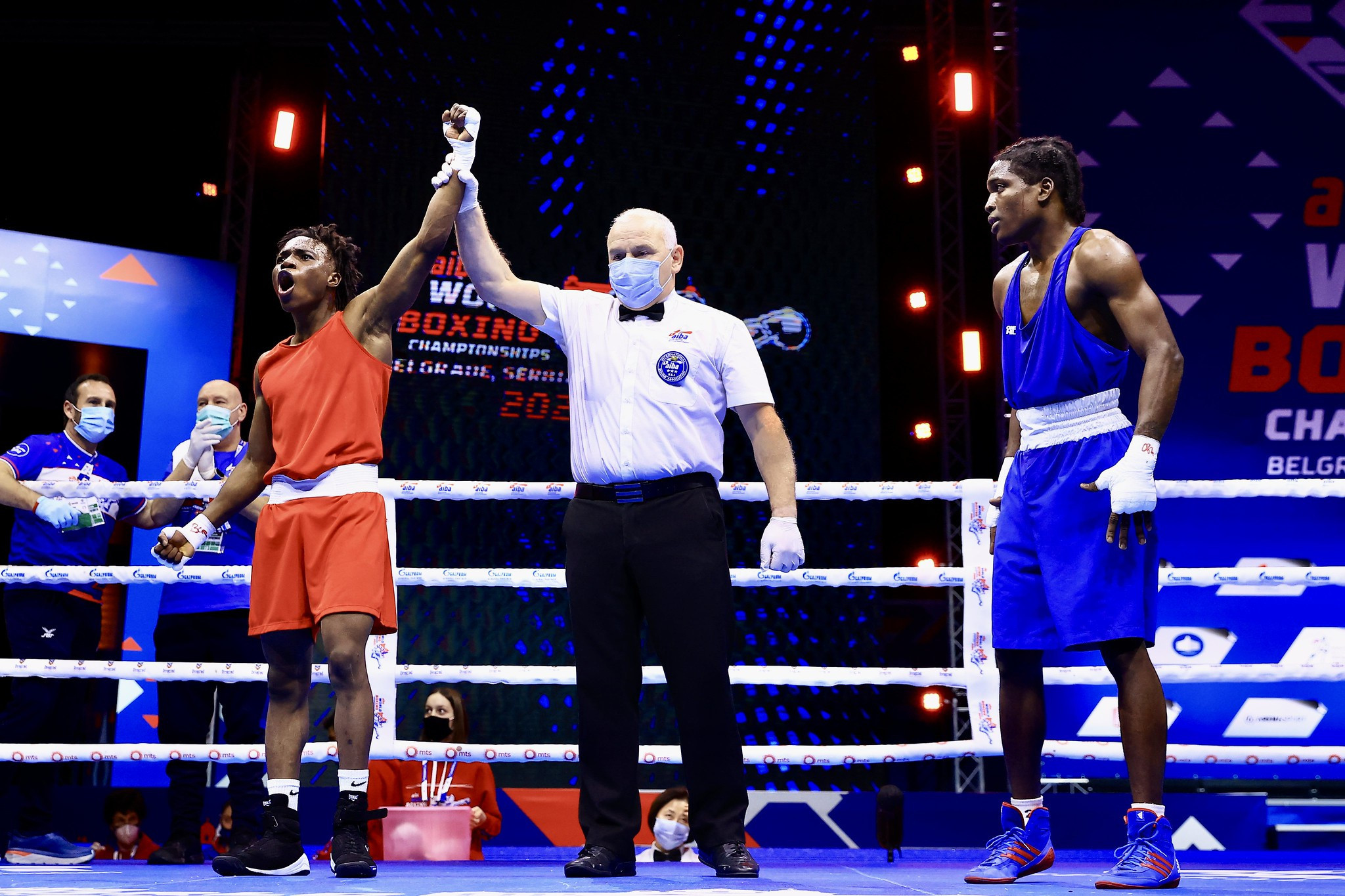 Abdule-Fawaz Aborode reacts to his arm being raised in his opening under-57kg bout ©AIBA