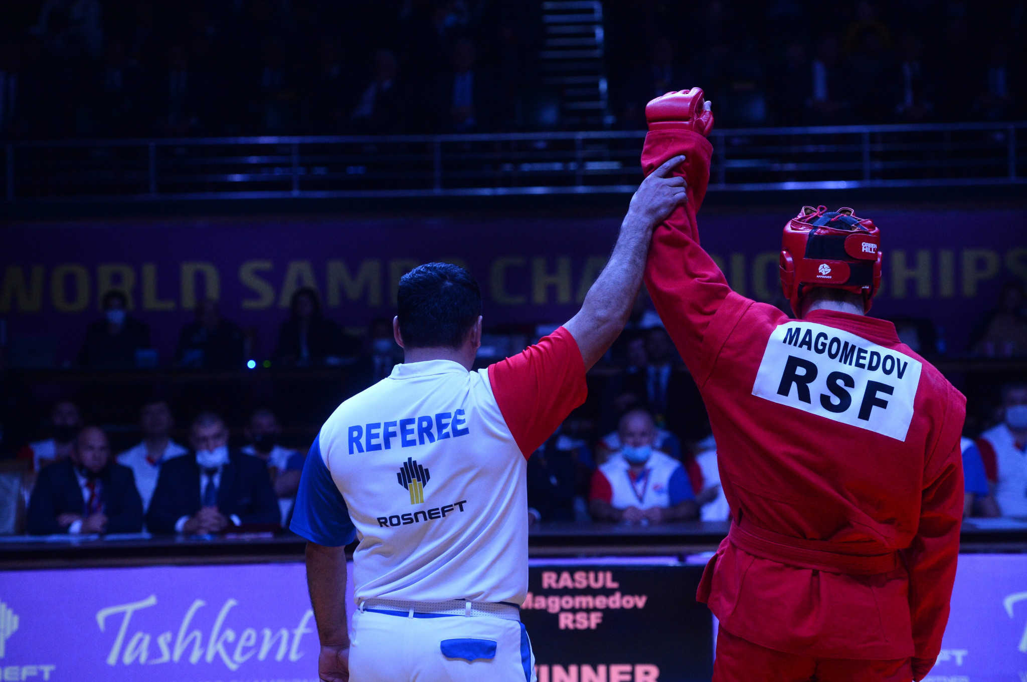Magomedov Rasul has his arm raised in victory after his opponent Raikhan Madi failed to show up for the final  ©FIAS