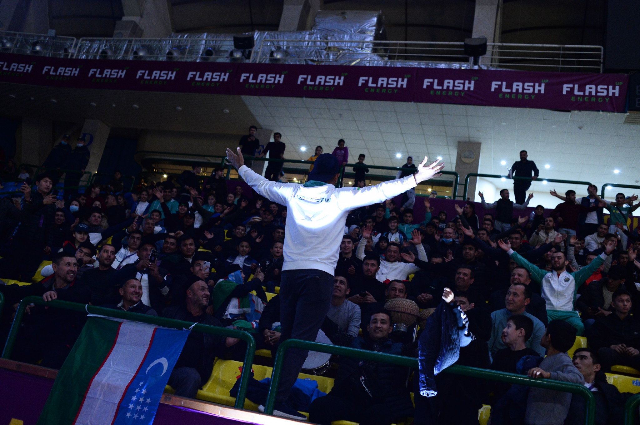 A supporter tries to get the home crowd going at the Yunusobod Sport Complex ©FIAS