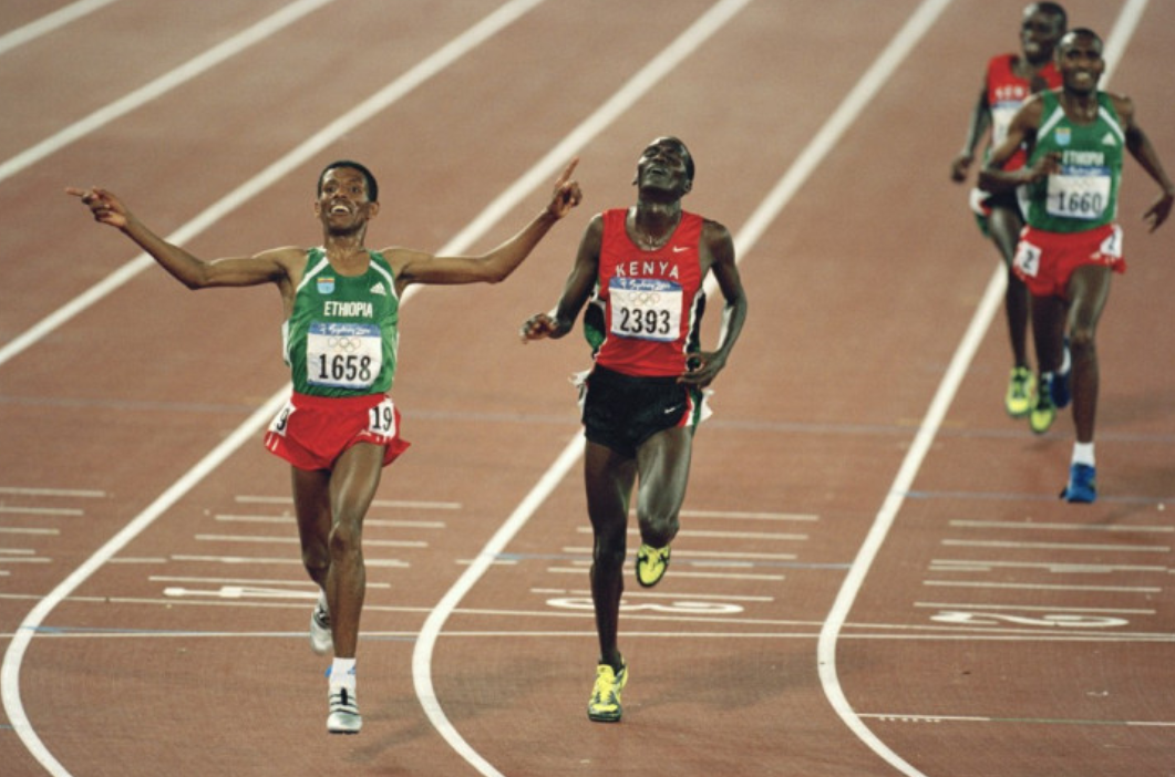 Ethiopia's Haile Gebrselassie earns victory over Kenya's Paul Tergat in the Sydney 2000 Olympics 10,000m final by a closer margin than the winner of the 100m earlier in the Games ©Getty Images