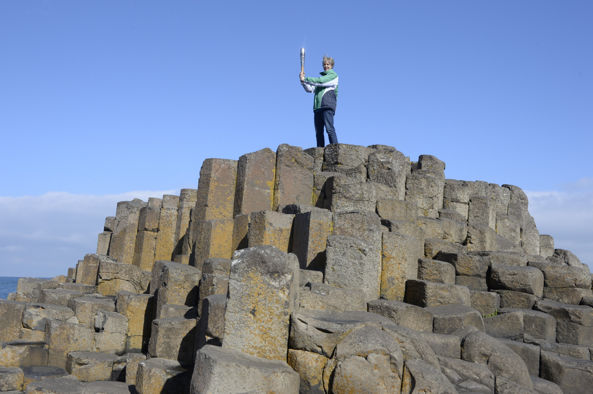 Alison Moffitt-Robinson at the Giant's Causeway, with the Glasgow 2014 Commonwealth Games baton ©Getty Images