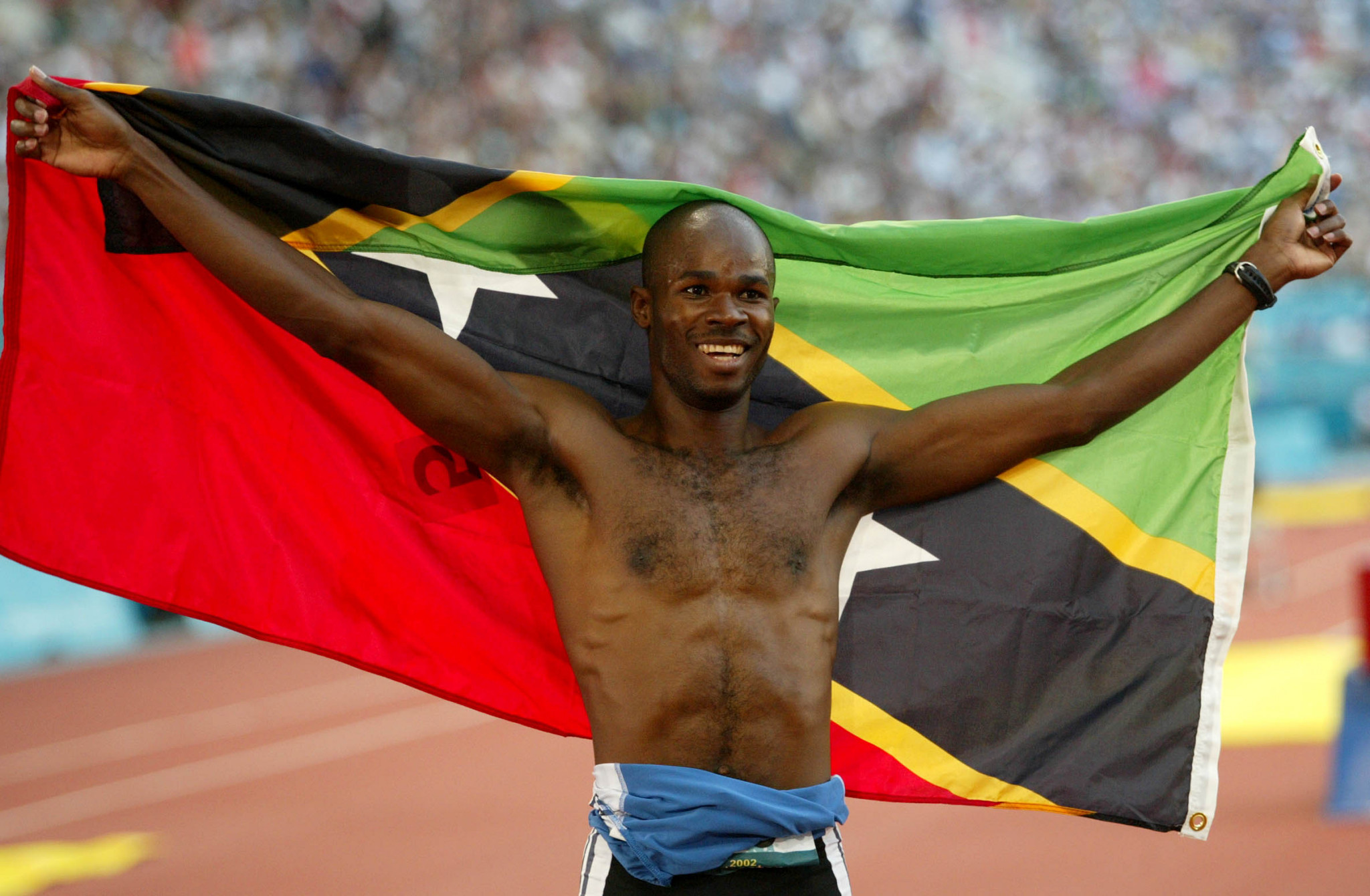 Kim Collins won 100 metres gold for Saint Kitts and Nevis at the Manchester 2002 Commonwealth Games ©Getty Images
