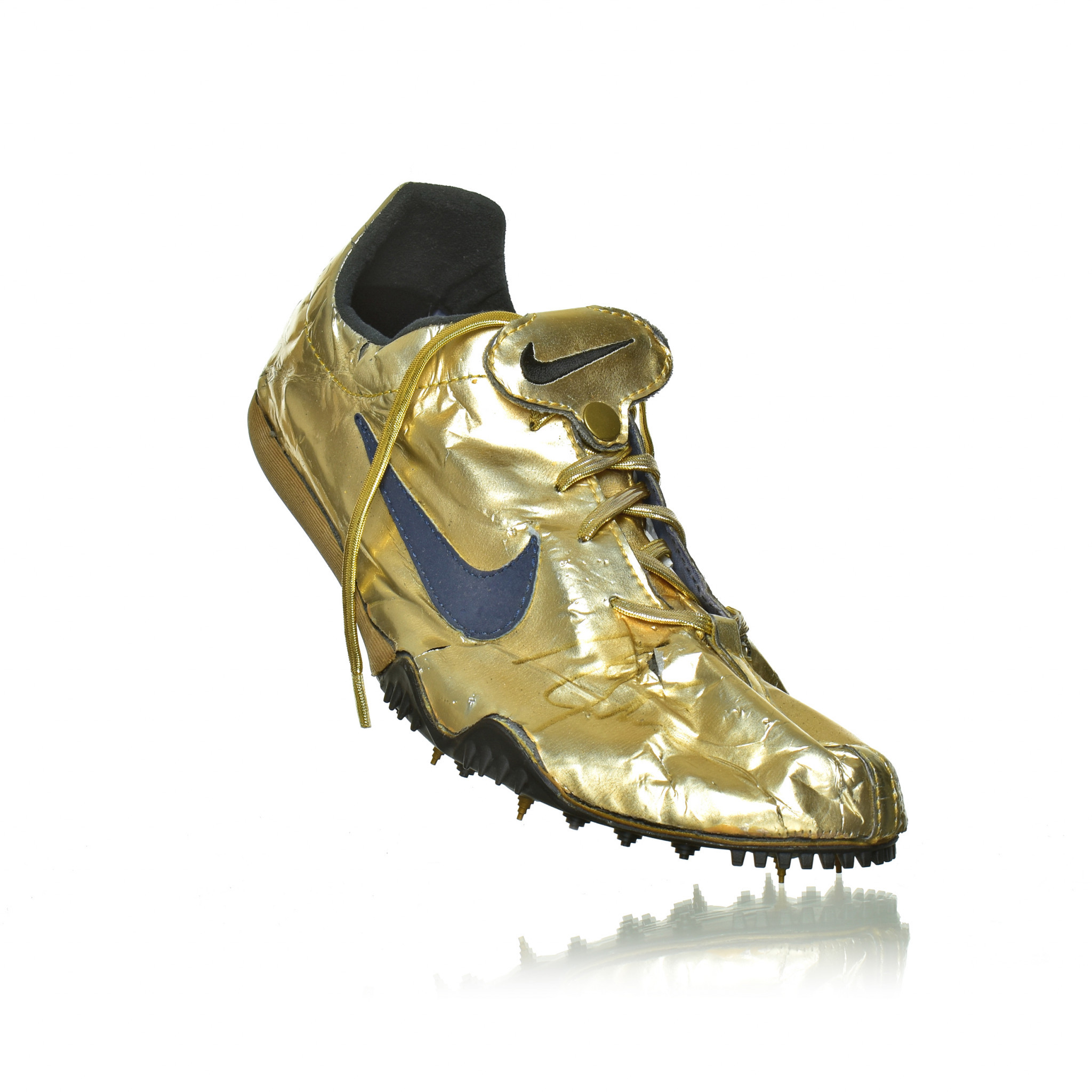 A golden shoe worn by Michael Johnson at the 1996 Atlanta Olympics - one of three such shoes which form the latest prize possession of the World Athletics Heritage Collection ©MOWA