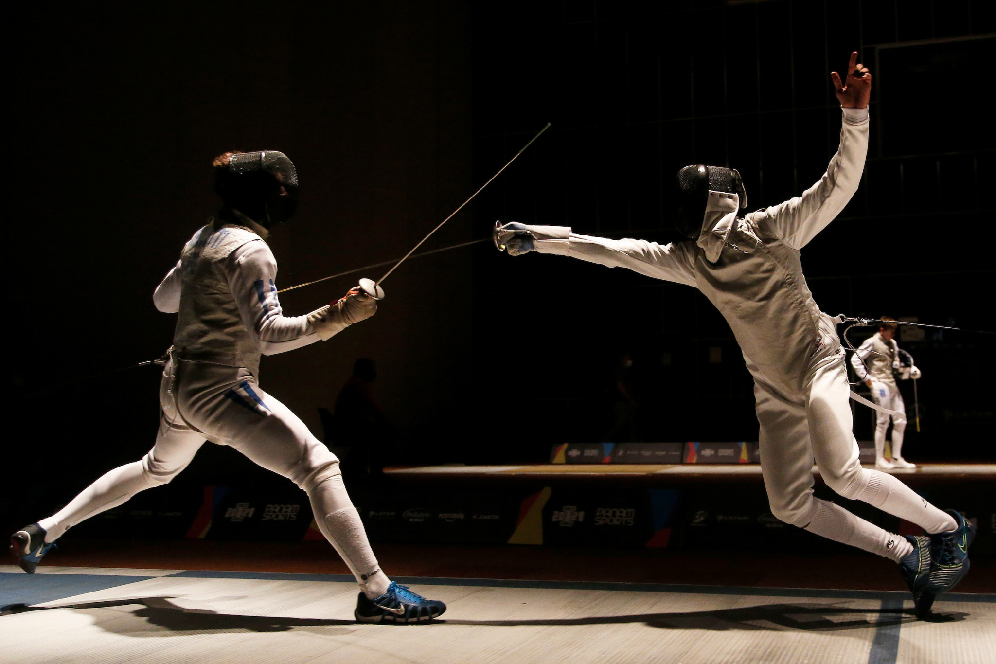 Dante Cerquetti of Argentina, left, downed Colombia's Miguel Grajales Mena in the men's individual foil fencing final ©Agencia.Xpress Media