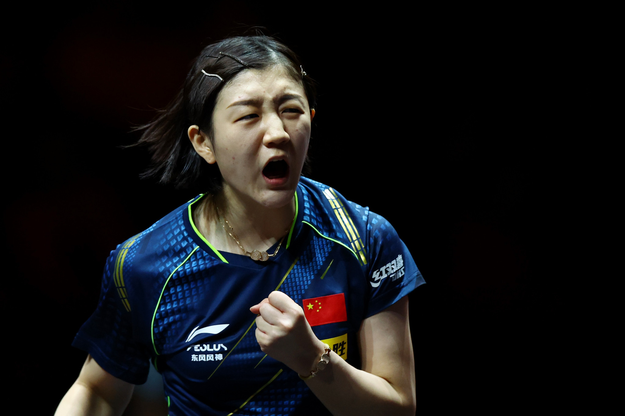 Chen Meng celebrates winning a point against Feng Tianwei at the WTT Cup Finals ©Getty Images