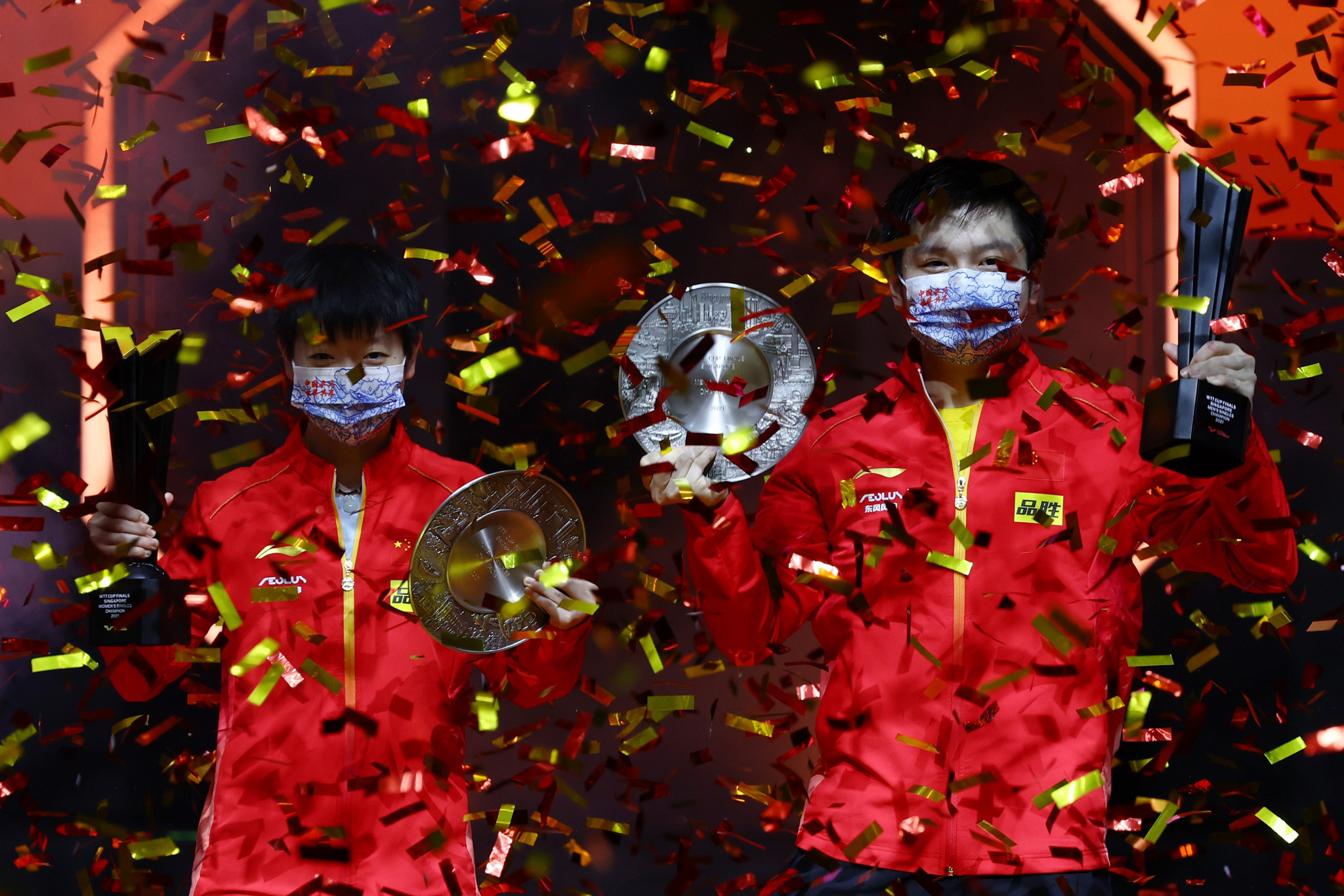 Sun Yingsha and Fan Zhendong celebrate after winning the respective women's and men's titles in Singapore ©Getty Images