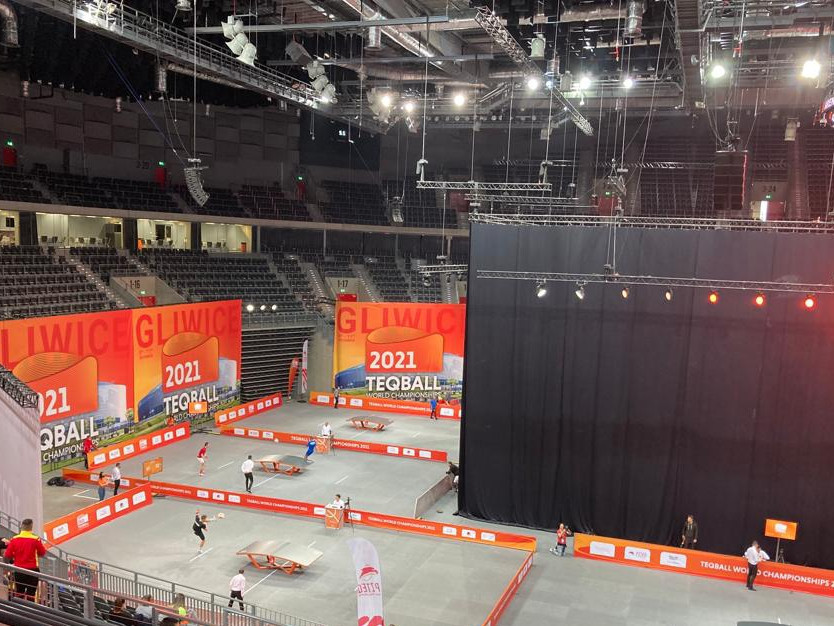 Eight tables are on the stage floor of the Gliwice Arena for the Teqball World Championships ©ITG