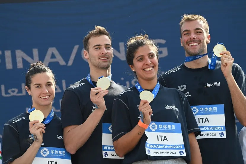 The Italian team celebrates after beating Hungary to gold in the open water mixed relay event in Abu Dhabi ©FINA