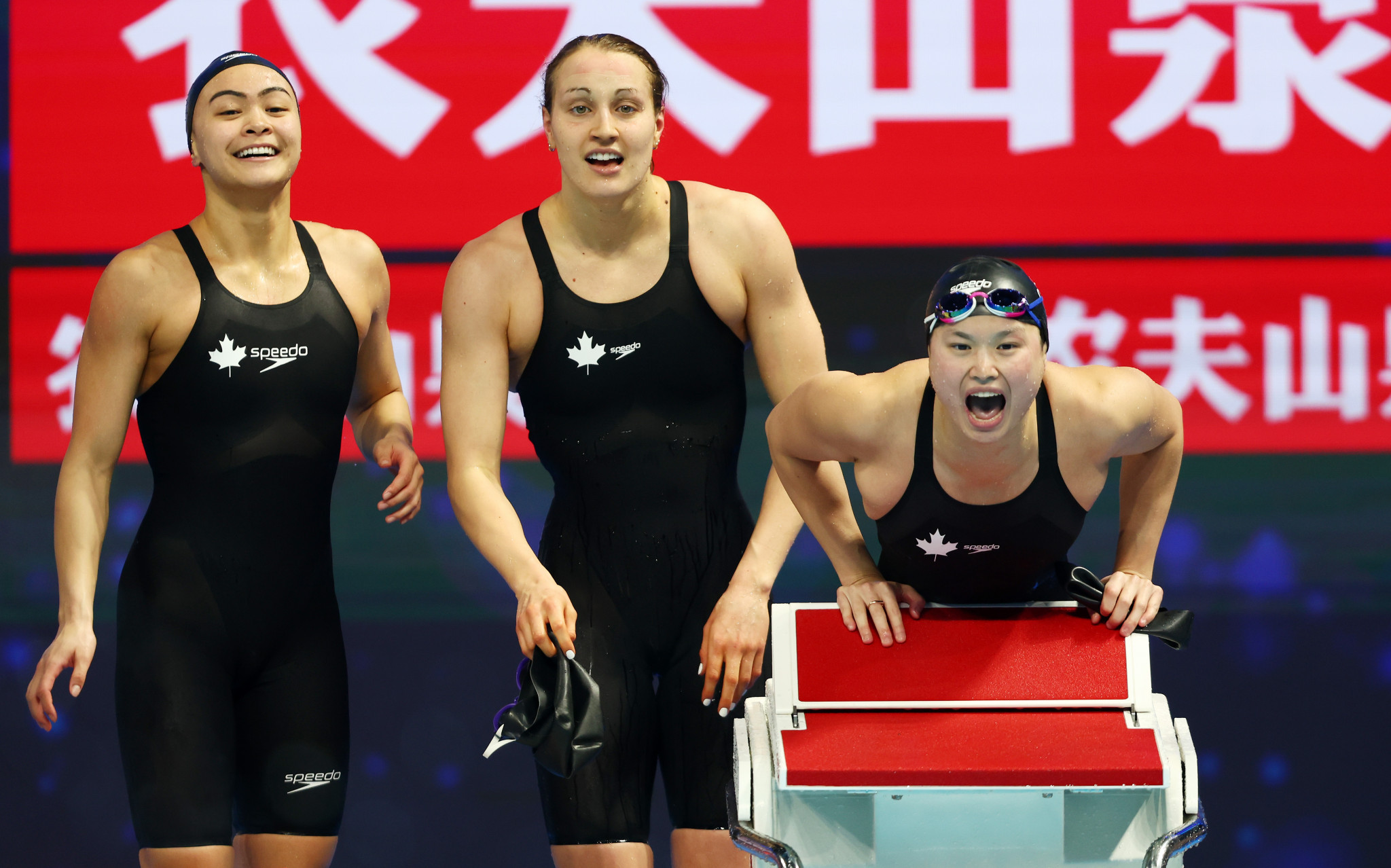 Members of the Canadian quartet get behind their team-mate as they shared the women's 4x100m freestyle relay crown with the United States ©Getty Images