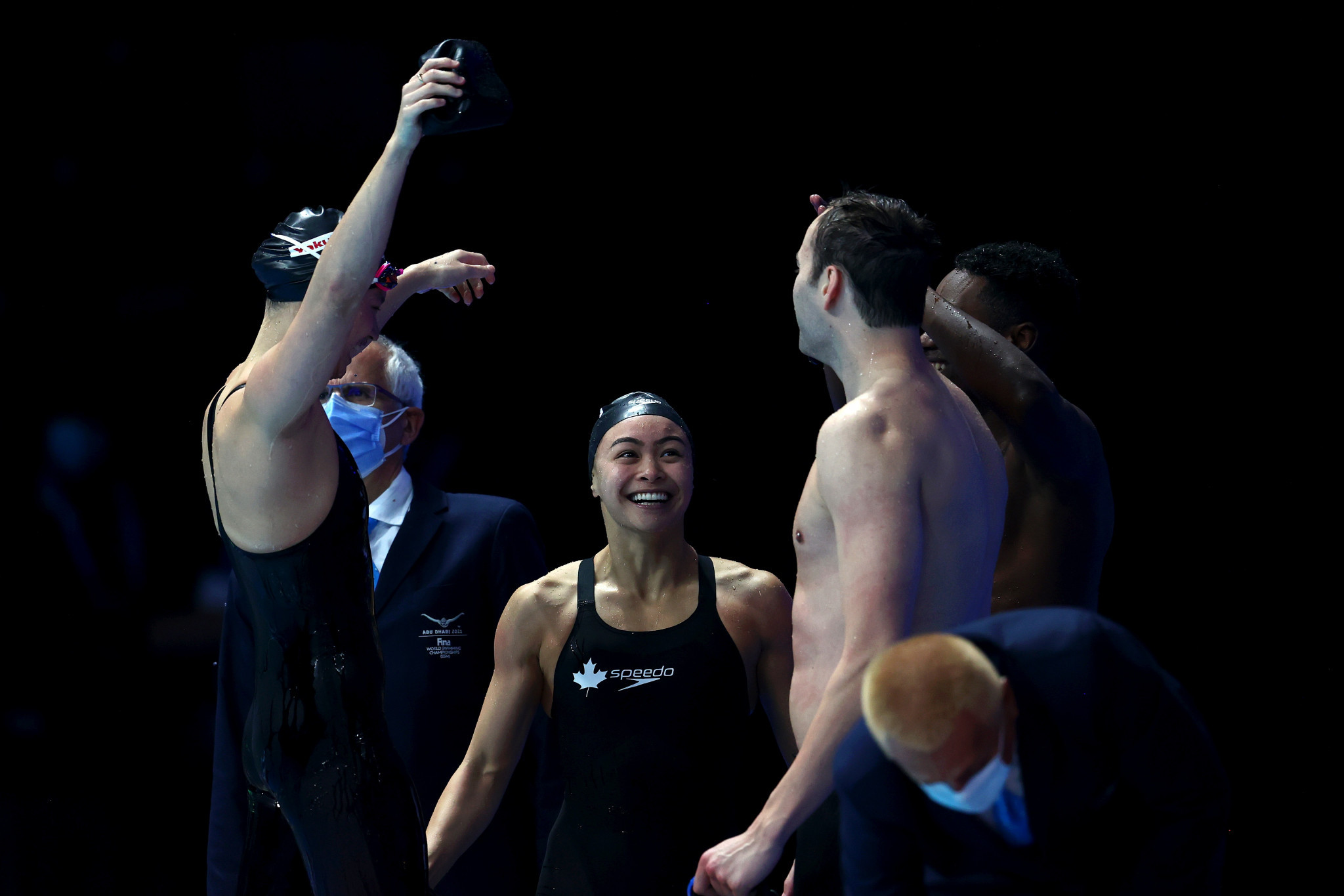Margaret MacNeil celebrates with her team-mates after winning the mixed 4x50m freestyle relay final ©Getty Images