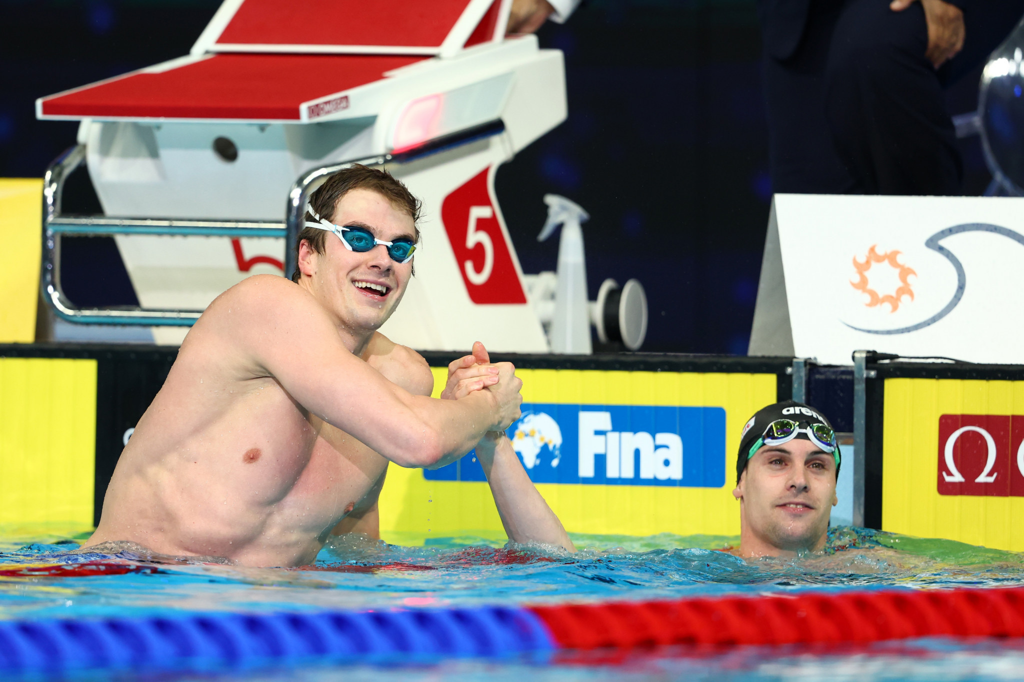 Nic Fink of the United States is congratulated after claiming his second breaststroke crown ©Getty Images