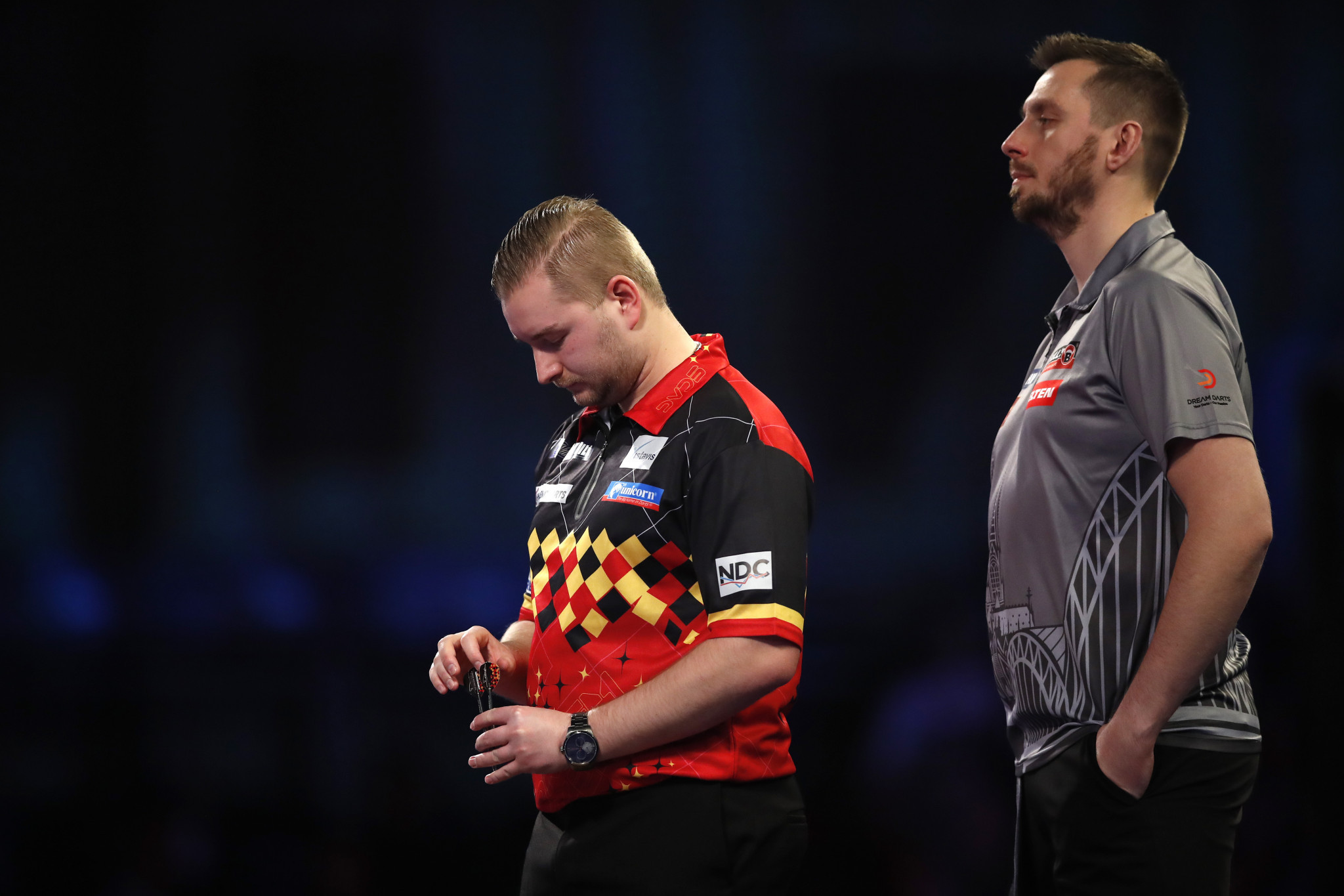 Dimitri Van den Bergh, left, has crashed out of the World Darts Championship ©Getty Images