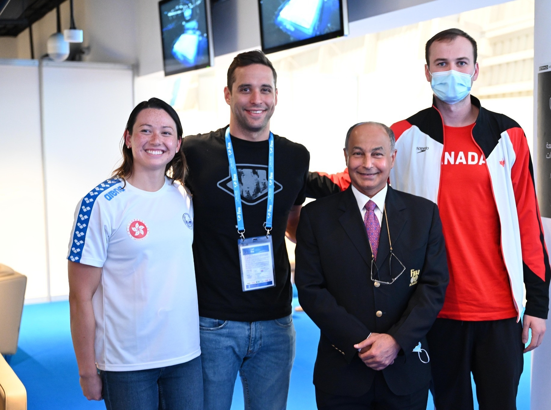 Husain Al-Musallam, second right, with Hong Kong's Siobhán Haughey, left, Chad le Clos of South African, second left, and Canadian Yuri Kisil ©FINA
