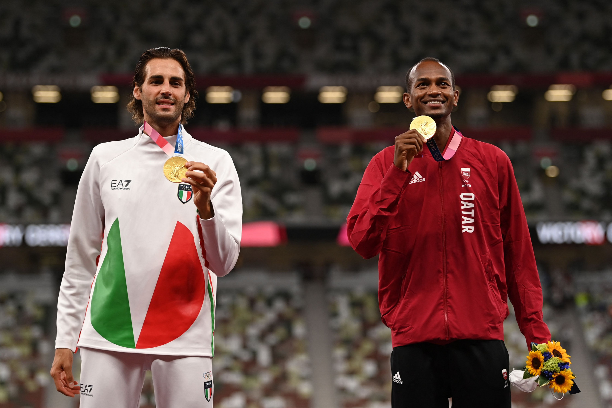 Golden double - Gianmarco Tamberi and Mutaz Barshim on the podium after their decision to share the Tokyo 2020 high jump title ©Getty Images