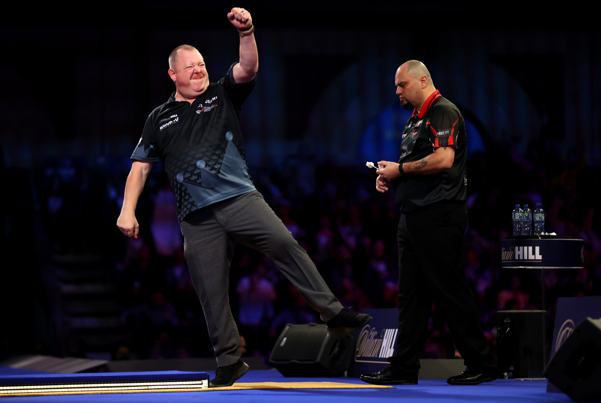 Mervyn King celebrates after coming back from the brink to defeat Raymond Smith at the PDC World Darts Championship ©Getty Images 