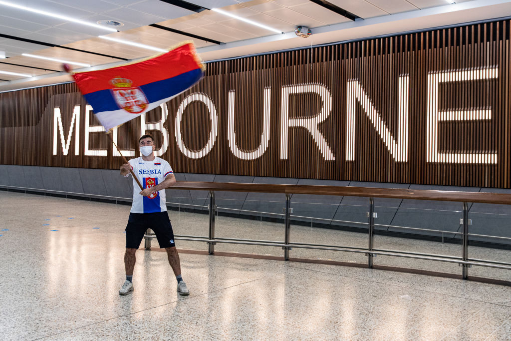 A Serbian fan waves a flag in support of Novak Djokovic following his arrival in Melbourne ©Getty Images