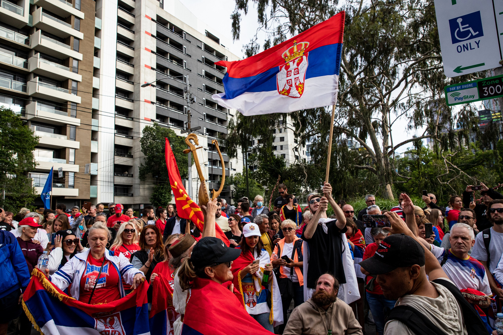 Supporters of Serbia's Novak Djokovic, as well as anti-vaccine demonstrators and refugee advocates, have gathered outside the hotel where he is being detained in Melbourne ©Getty Images