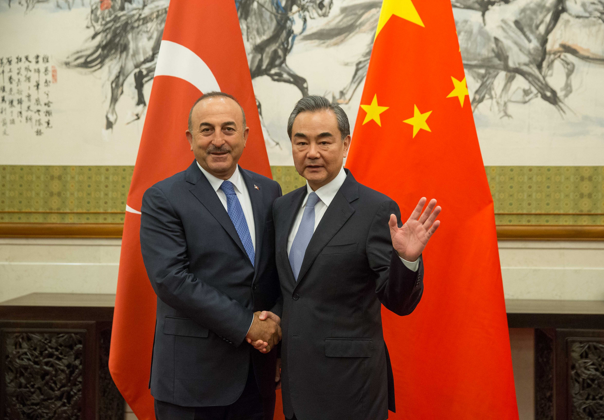 Uyghur Muslims in Xinjiang were discussed by Turkish Foreign Minister Mevlüt Çavuşoğlu, left, and his Chinese counterpart Wang Yi, right, according to the Turkish side ©Getty Images