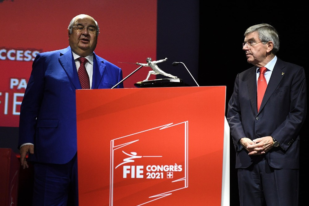 FIE President Alisher Usmanov, left, has donated CHF90 million towards the governing body's finances since 2008 ©FIE