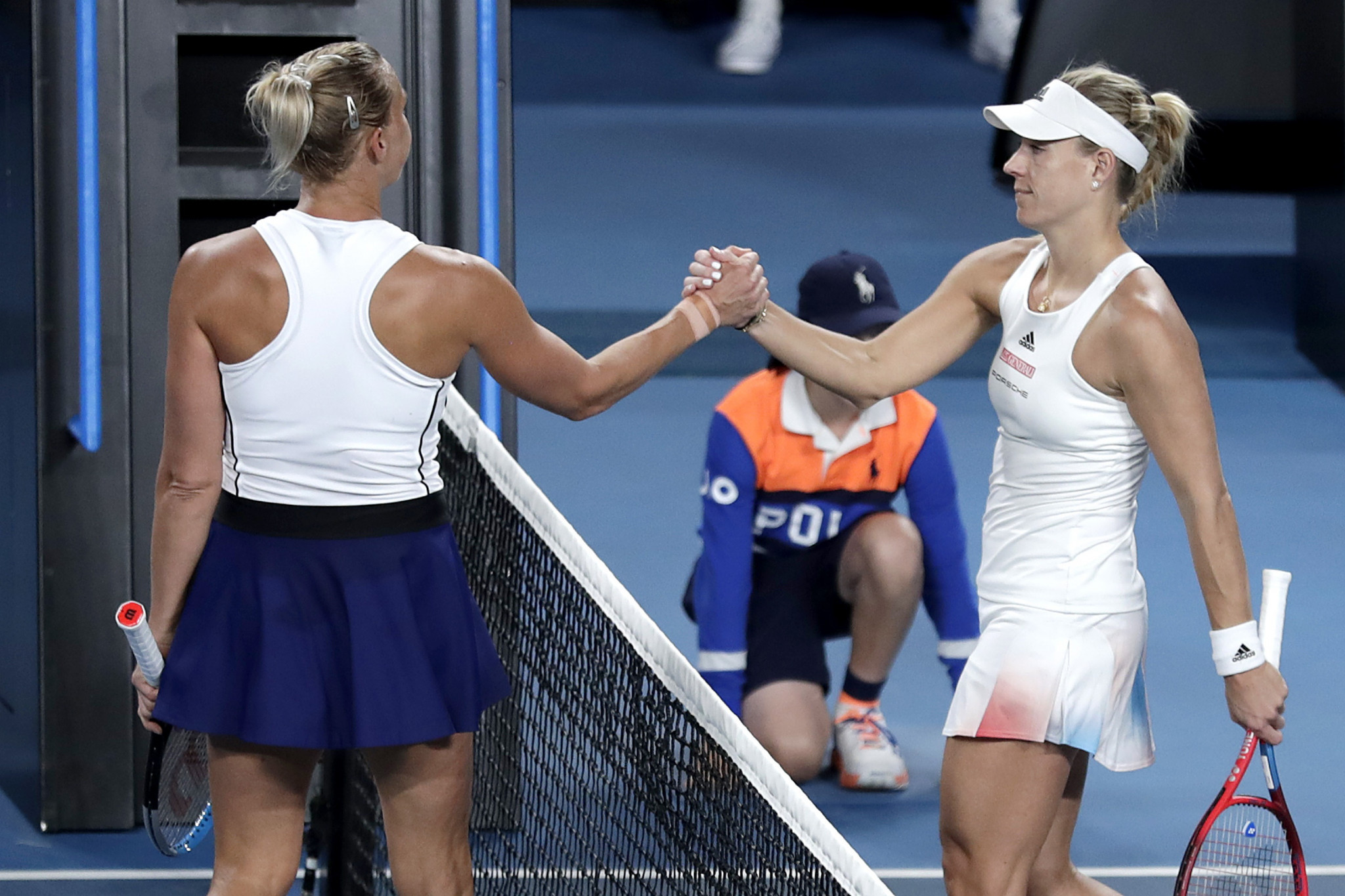 Former Australian Open champion Angelique Kerber of Germany, right, bowed out following a straight-sets loss to Estonian Kaia Kanepi ©Getty Images