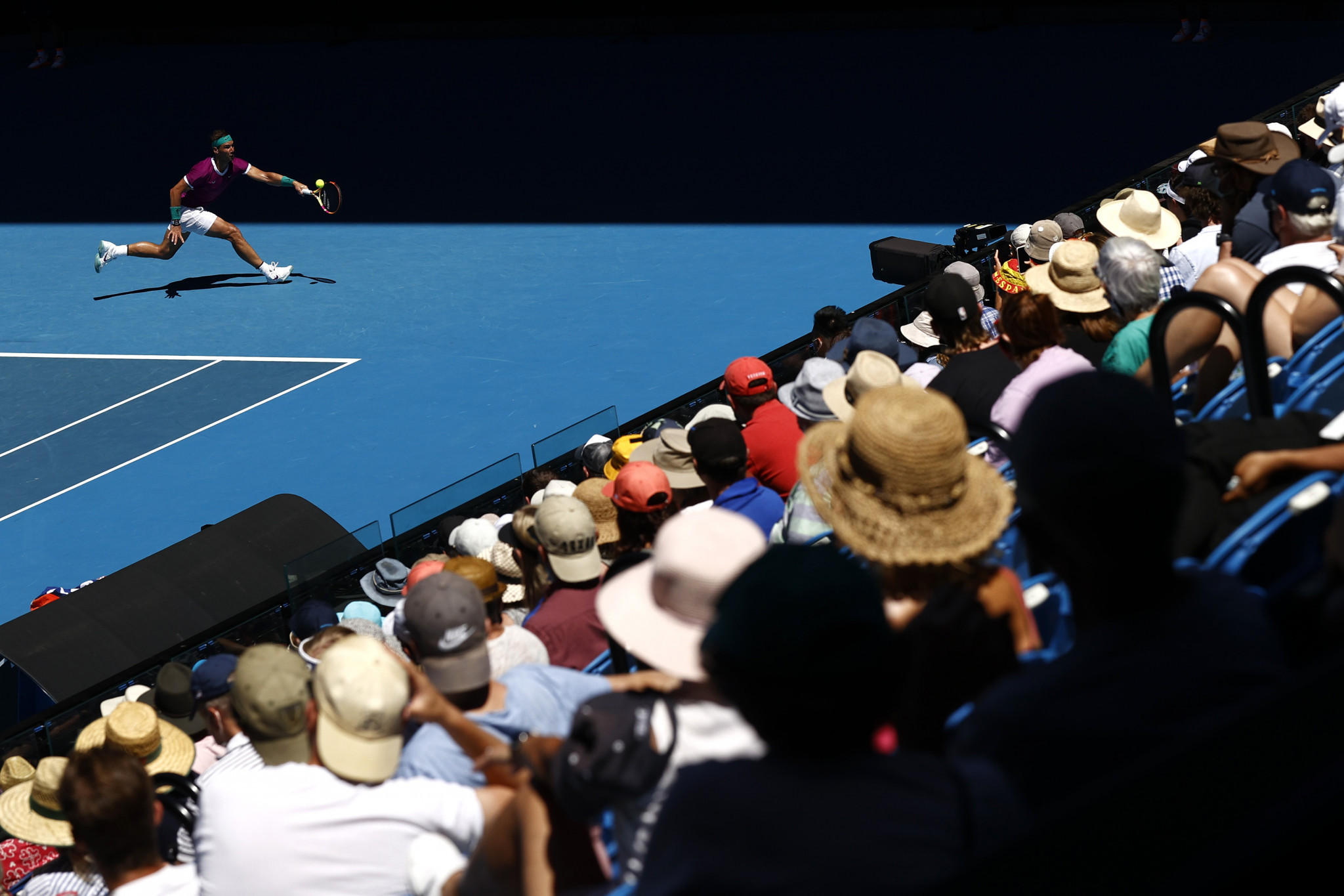 The Melbourne crowd watch on as Nadal stretches for the ball ©Getty Images