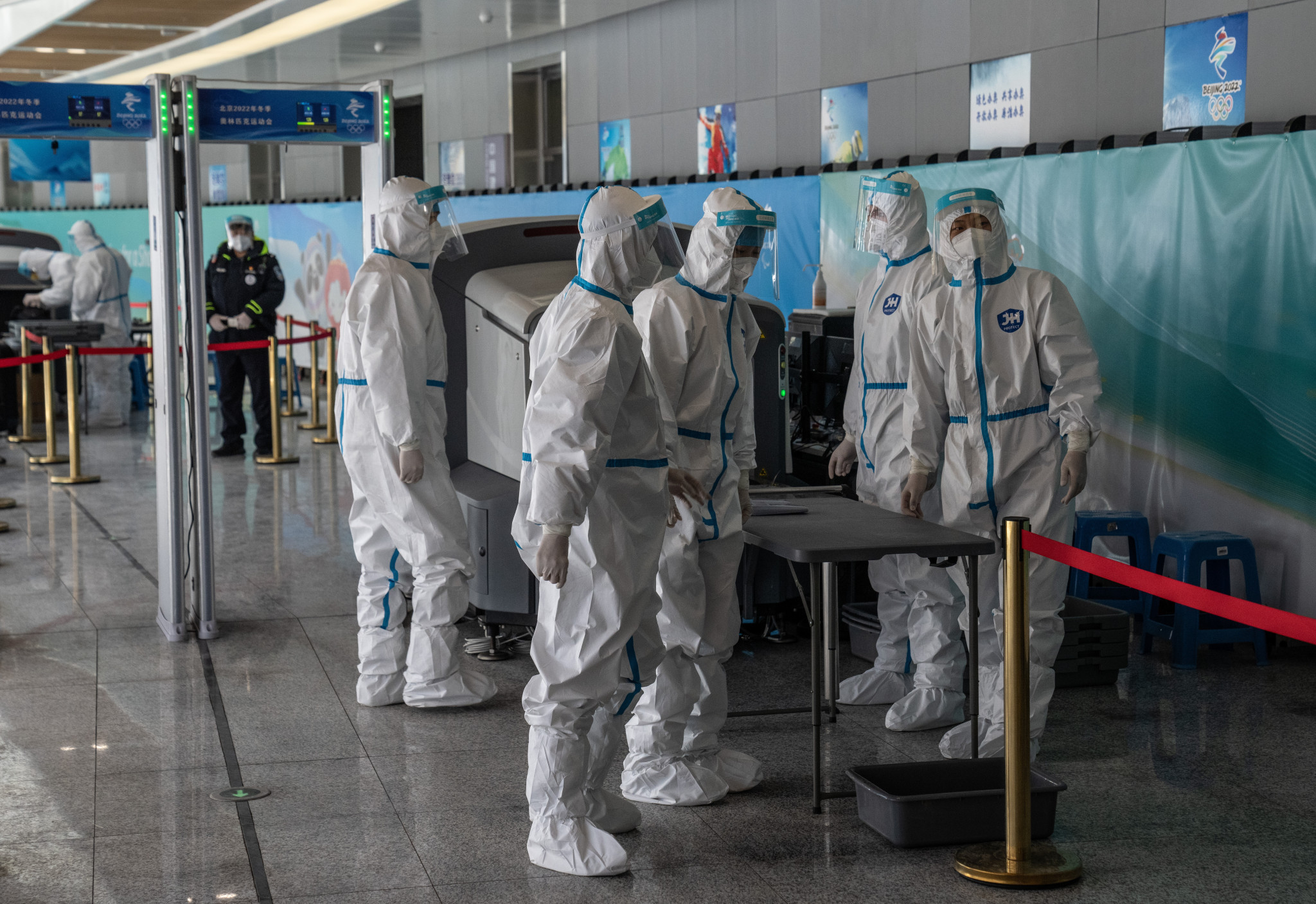 Security staff in full personal protective kit wait to check people arriving in Zhangjiakou where the German support staff member tested positive for COVID-19 ©Getty Images
