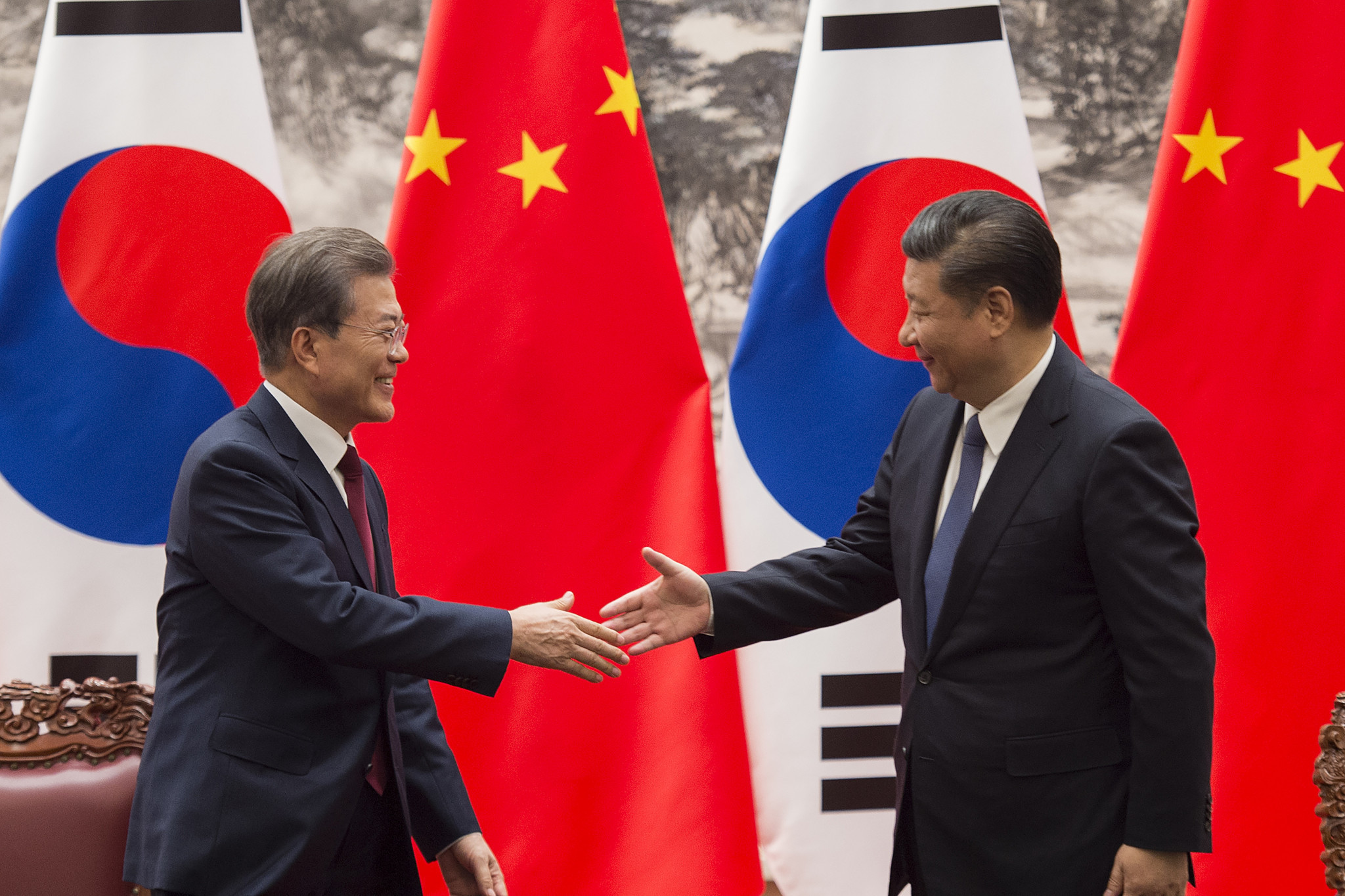 South Korean President Moon Jae-in, left, and Chinese counterpart Xi Jinping, right, agreed to 