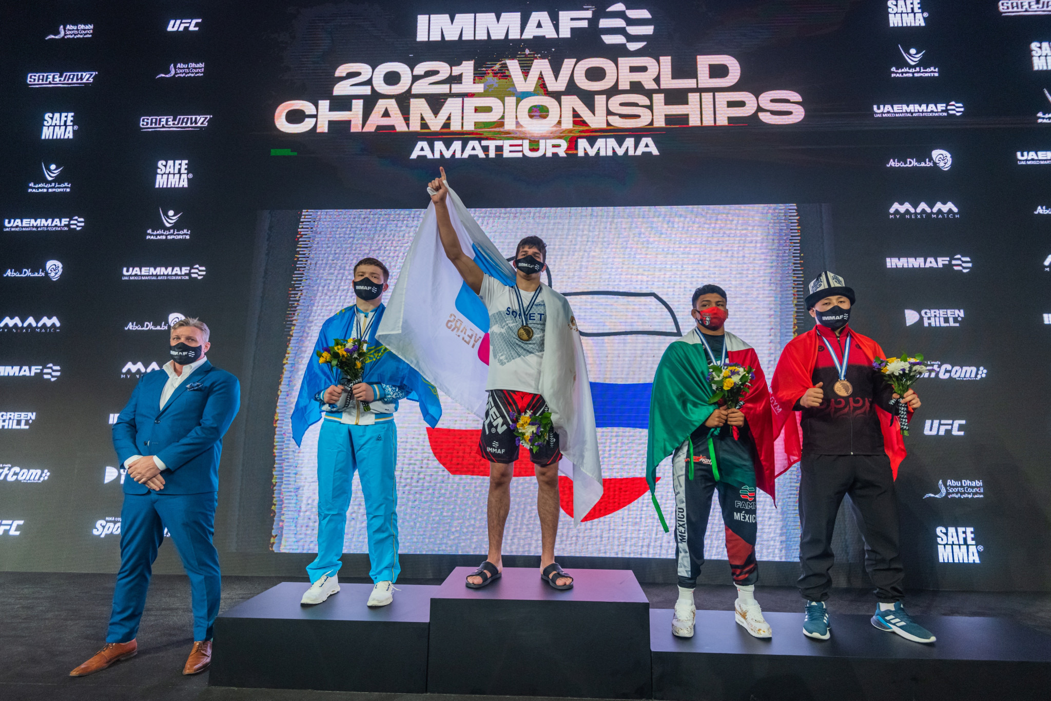 Muhamed Afandi Asipov stands on top of the men's junior middleweight podium ©IMMAF