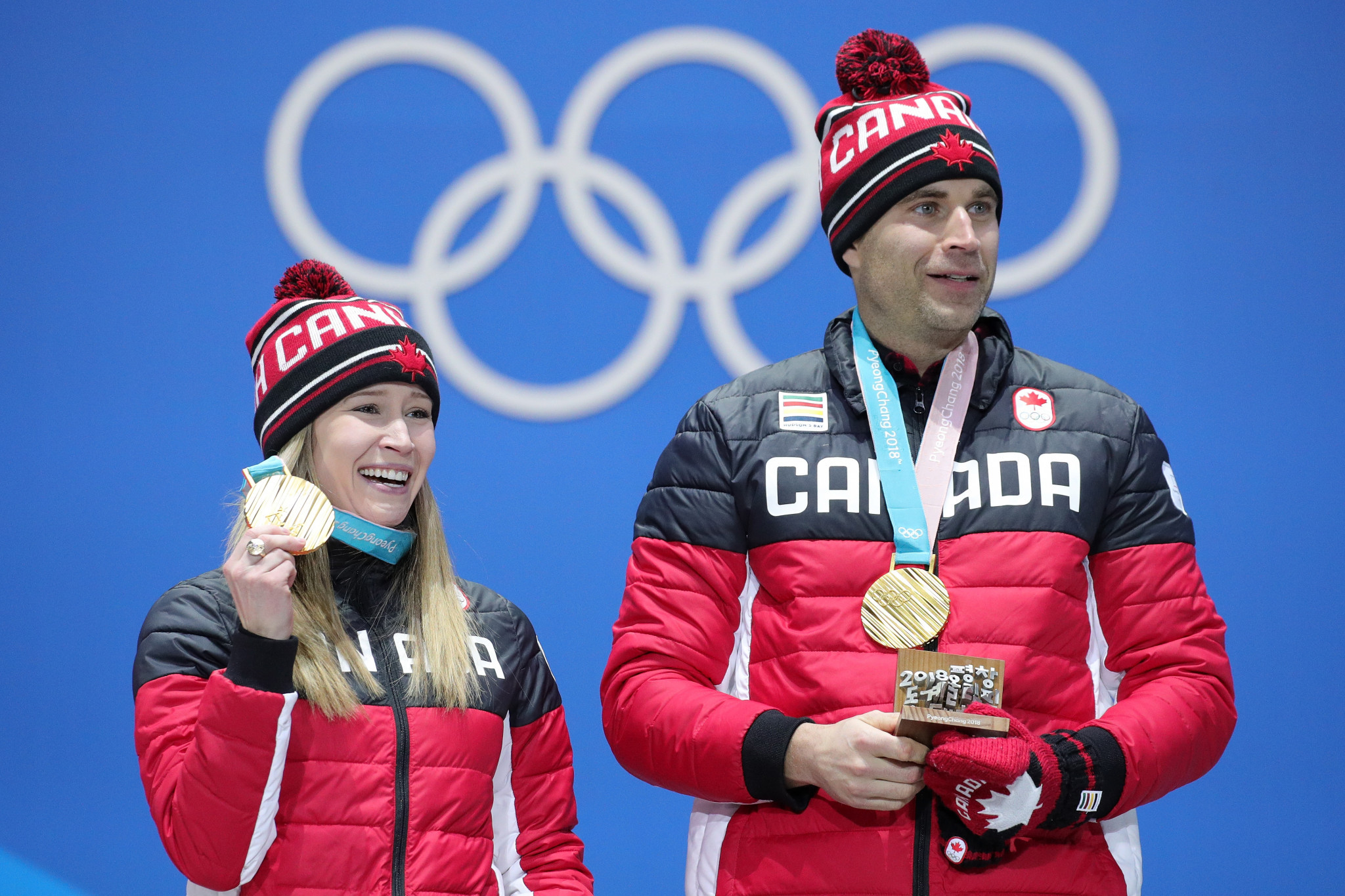 Canada's John Morris, right, pictured with former mixed doubles partner Kaitlyn Lawes, won the first Olympic gold medal in mixed doubles curling at Pyeongchang 2018  ©Getty Images