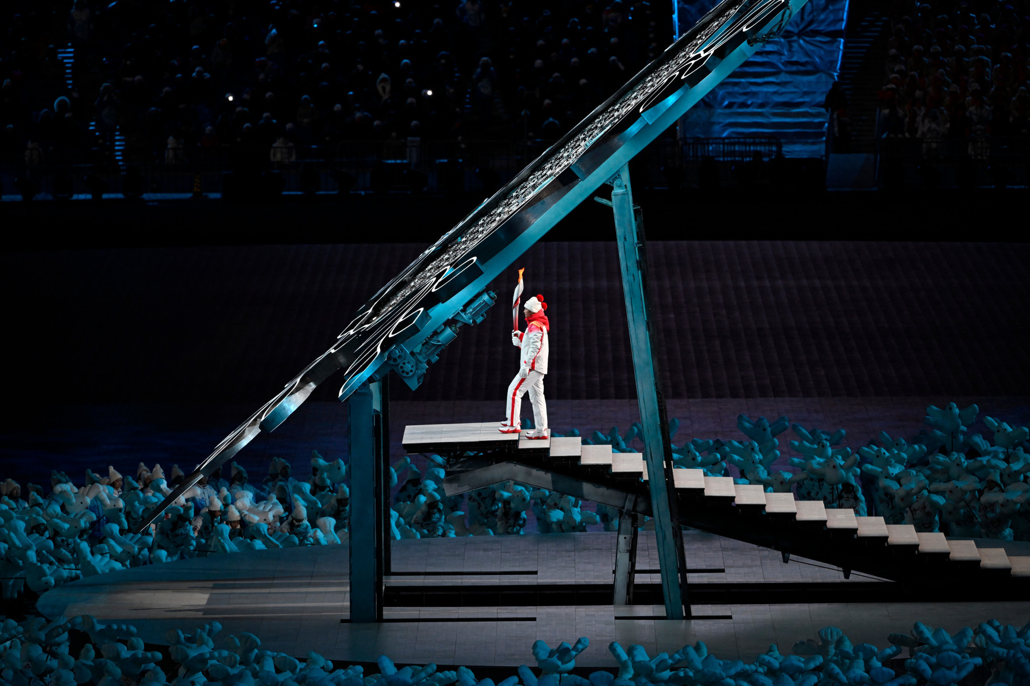 Dinigeer Yilamujiang and Zhao Jiawen lit the Olympic Cauldron at the National Stadium ©Getty Images