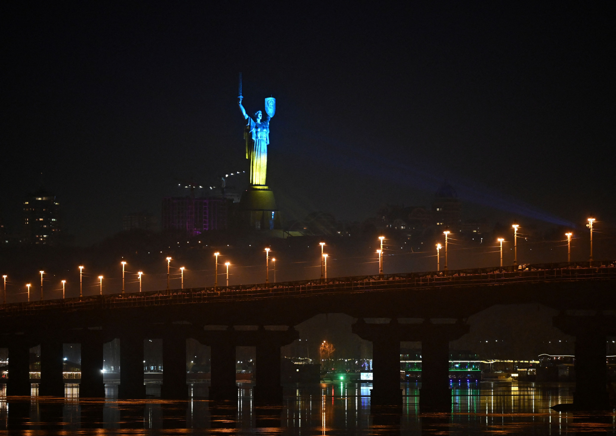 Kyiv's Motherland Monument has been lit up in the colours of the Ukrainian flag amid high tension with Russia ©Getty Images