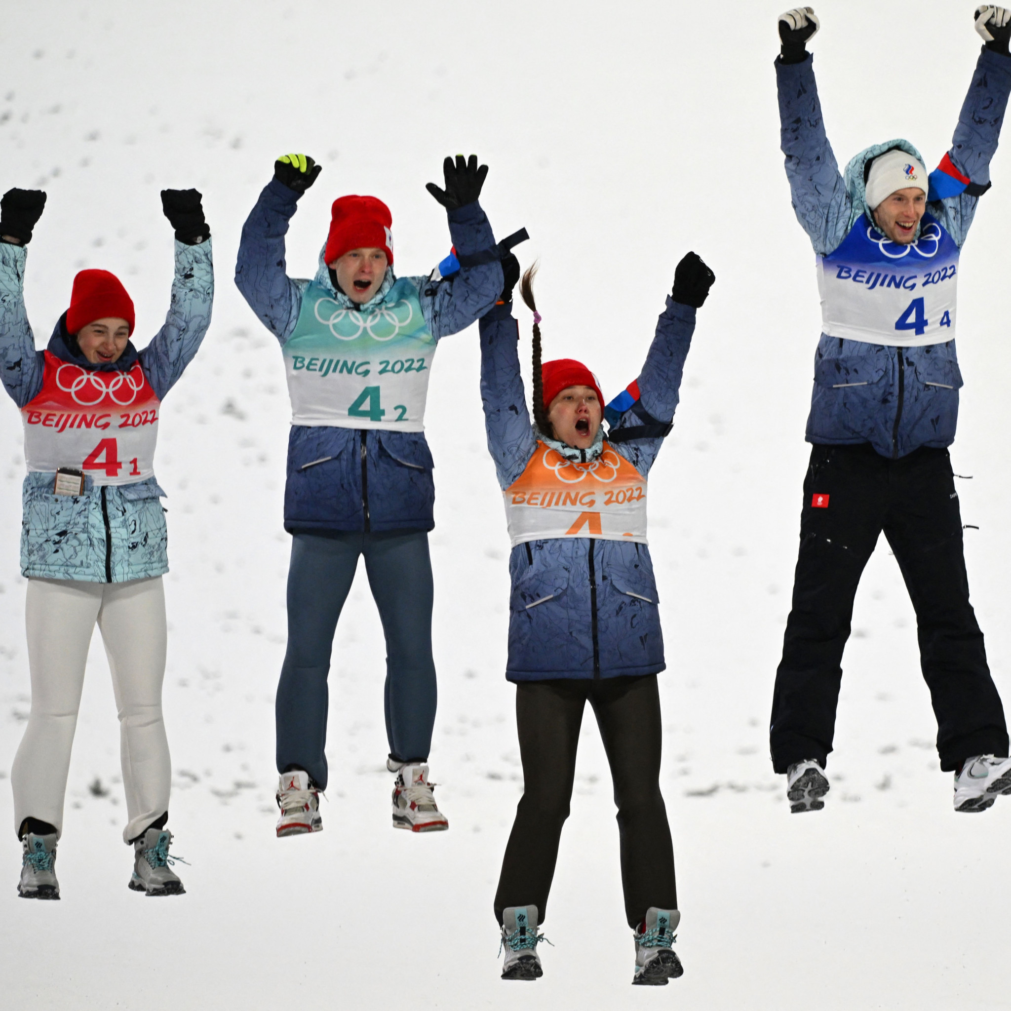Irma Makhinia, Danil Sadreev, Irina Avvakumova and Evgeniy Klimov won a mixed team ski jumping silver medal ©Getty Images