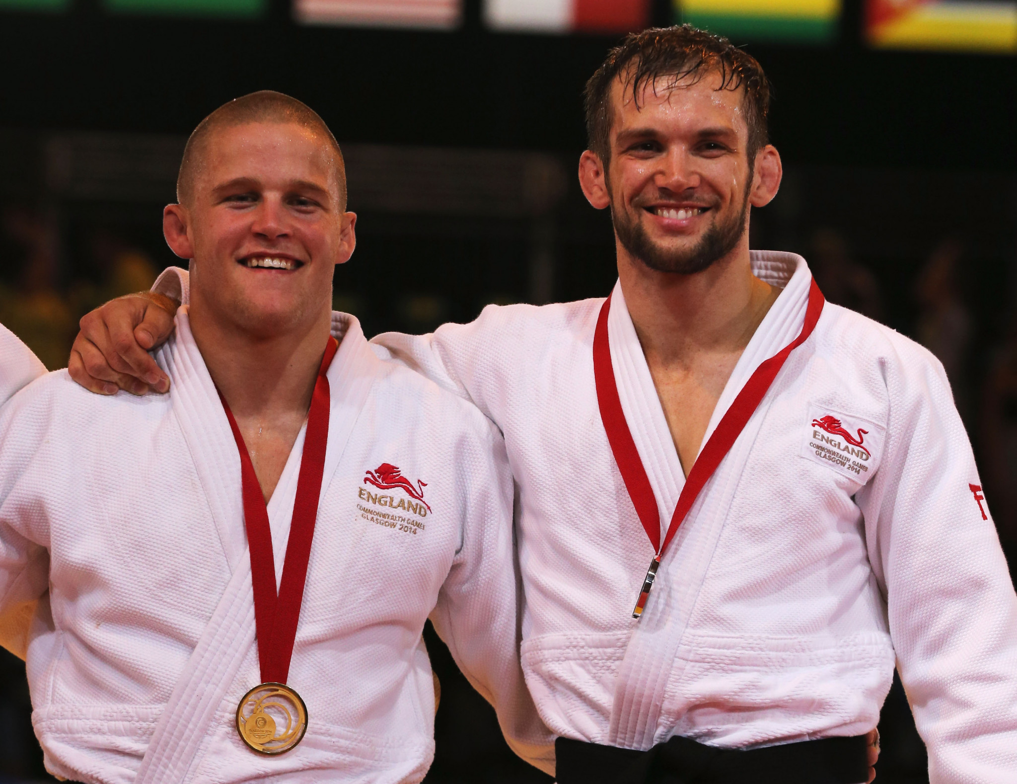 English judoka Owen Livesey, left, and Tom Reed, with their respective gold and silver medals at the Glasgow 2014 Commonwealth Games ©Getty Images