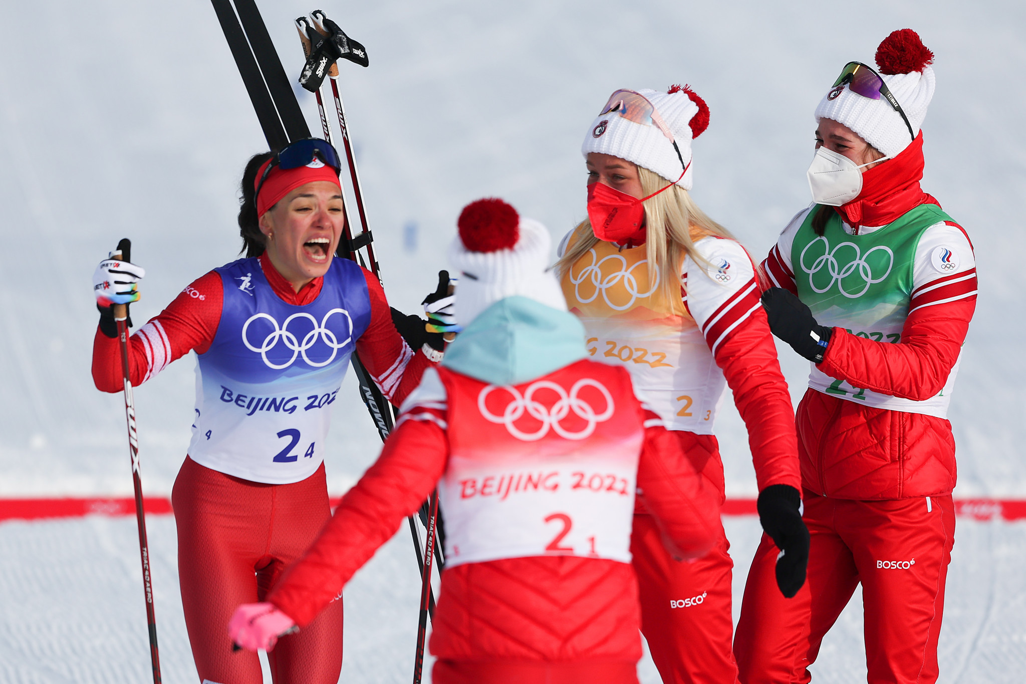 The Russian Olympic Committee team celebrate at the finish line after winning gold in the women's 4x5 kilometres cross-country skiing relay ©Getty Images 