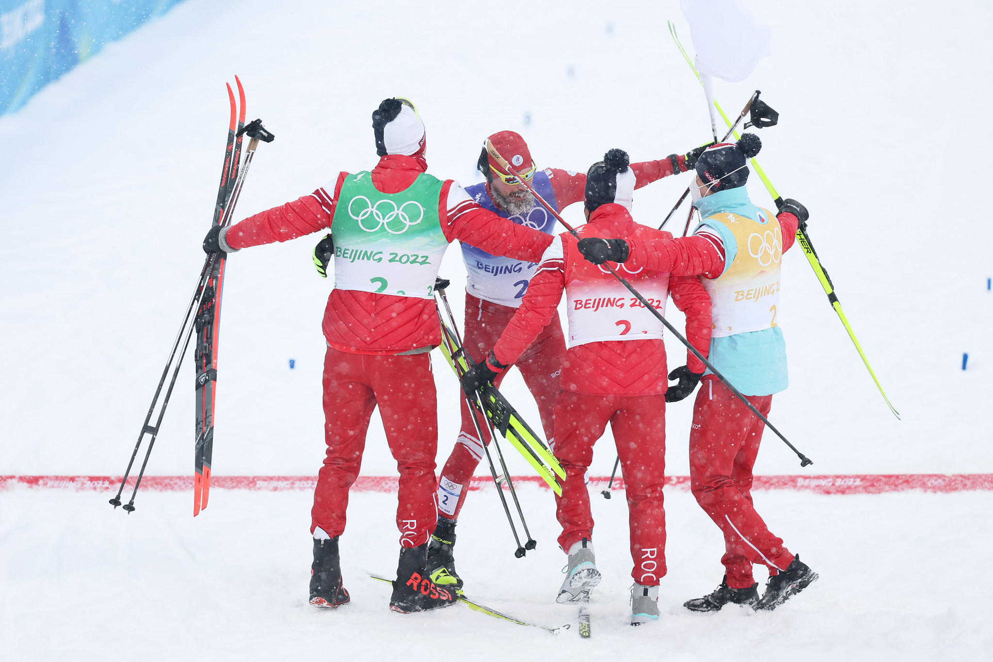 The Russian Olympic Committee (ROC) team celebrate after winning the men’s 4x10km cross country relay ©Getty Images