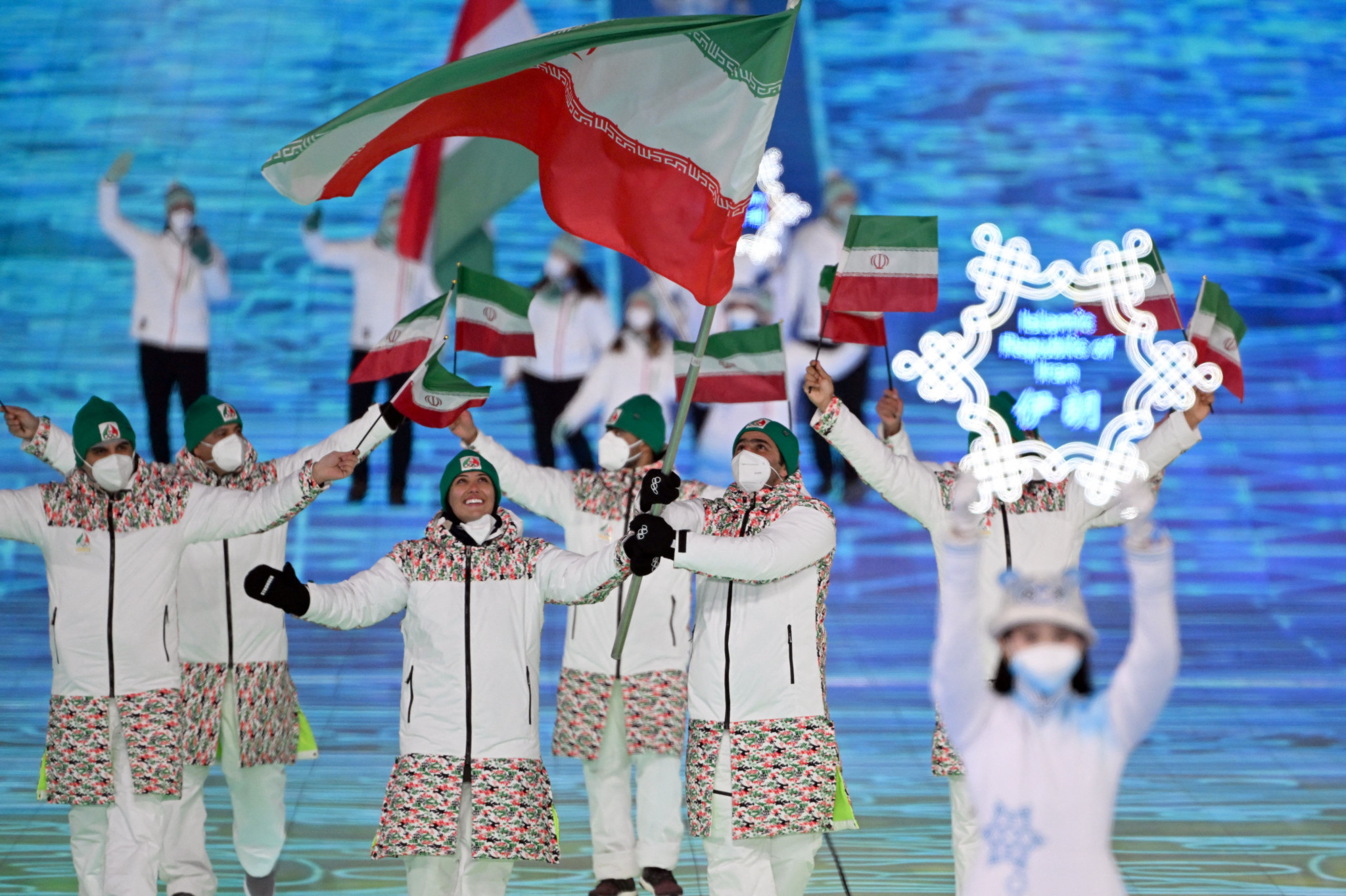 Hossein Saveh Shemshaki, right, carried the Iranian flag along with Atefeh Ahmadi at the Opening Ceremony in Beijing ©Getty Images