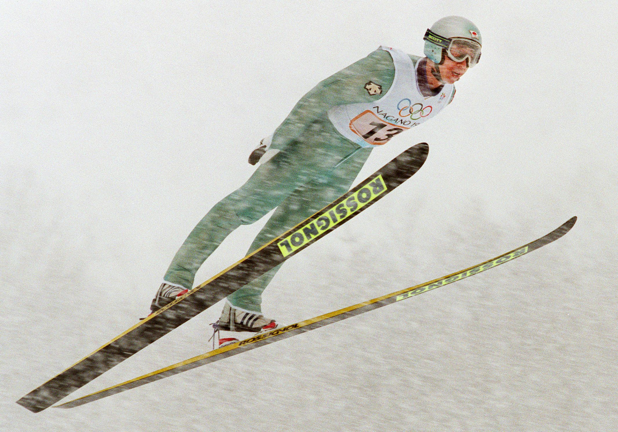 Masahiko Harada en route to his huge and decisive second effort - after a terrible first - which helped Japan secure gold in the men's team ski jump event at the home 1998 Winter Olympics in Nagano ©Getty Images