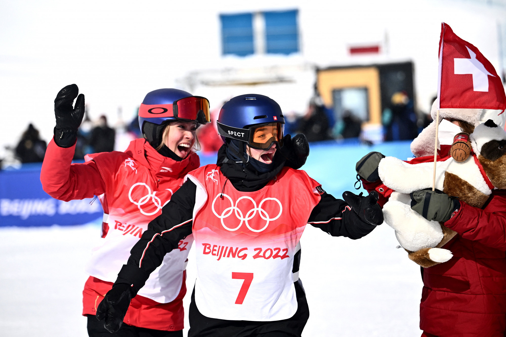 Switzerland's Mathilde Gremaud, right, celebrating her women's ski slopestyle Olympic gold medal at Beijing 2022 with China's Eileen Gu, left ©Getty Images